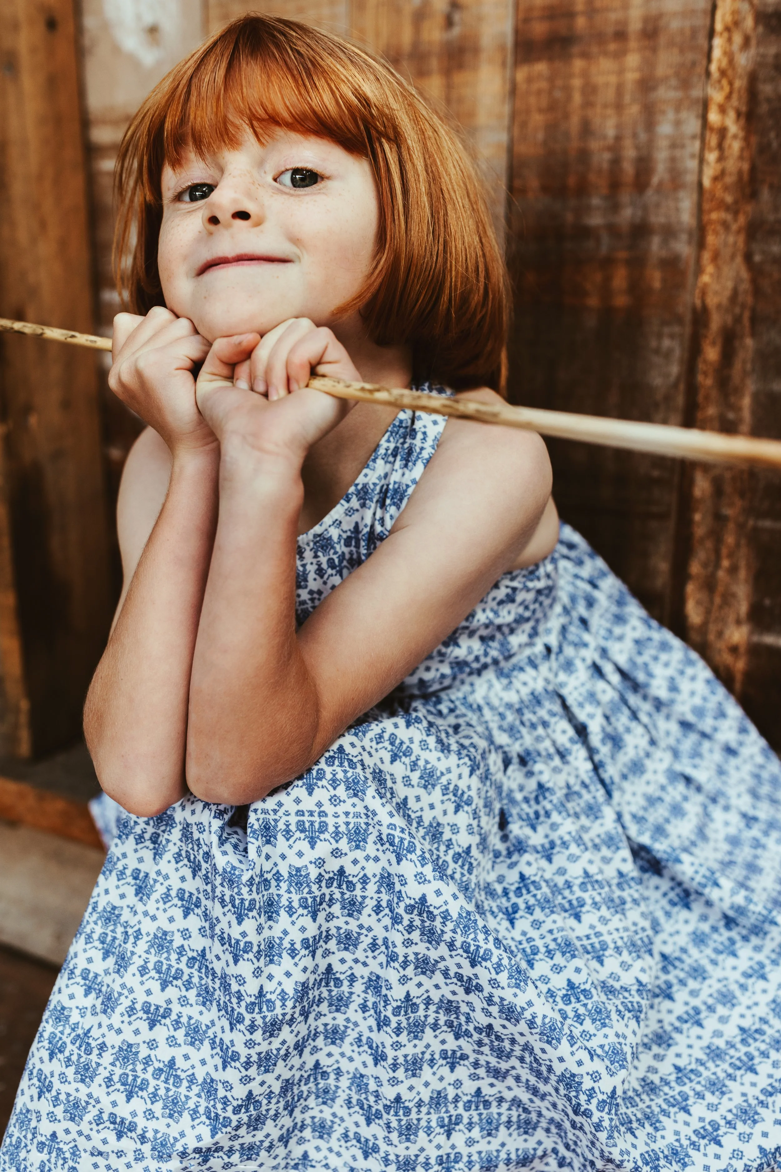 Child models blue dress for commercial photo shoot in Hobart.