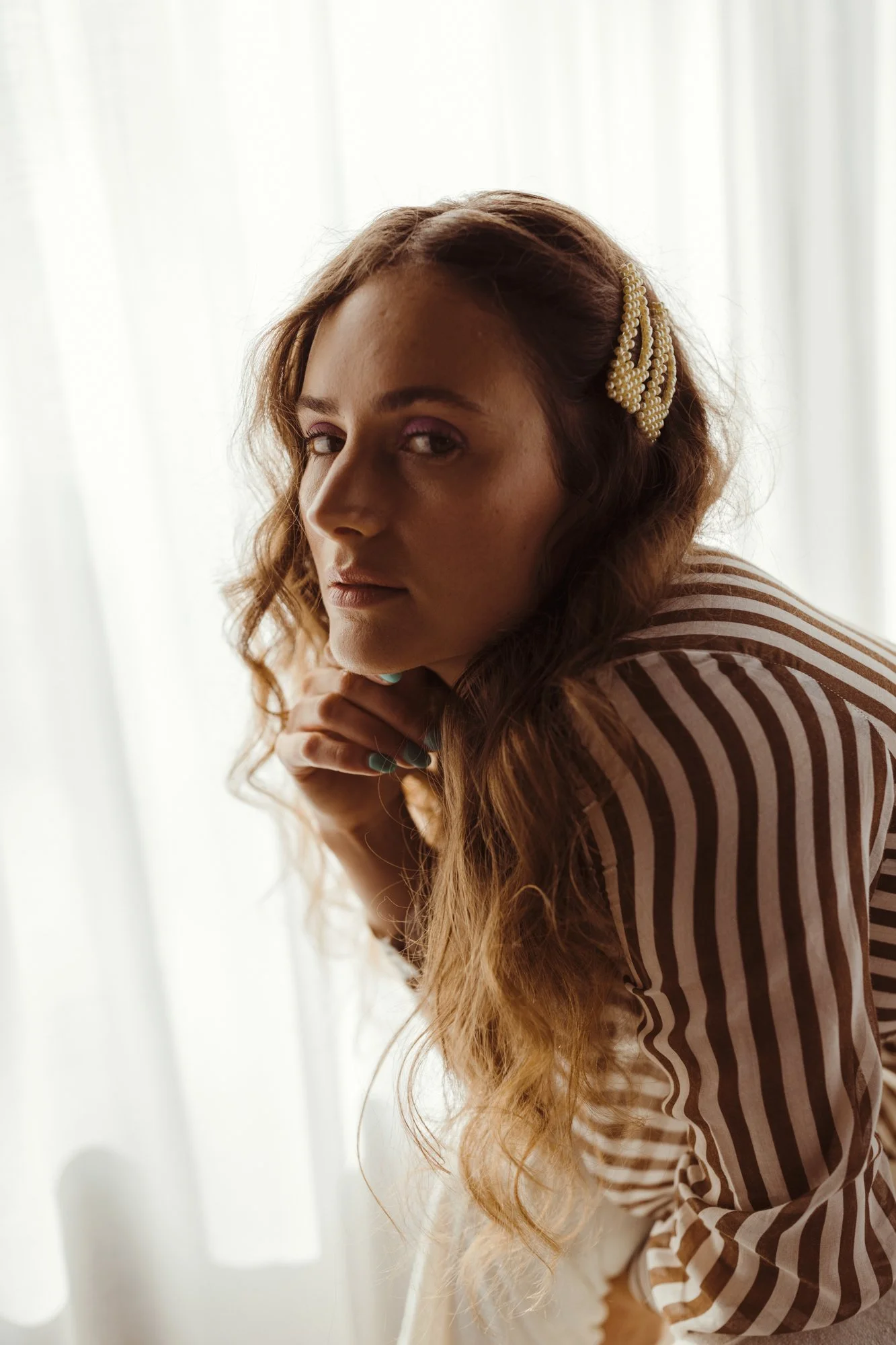 Model poses in vintage luxe fashion photo shoot in West Hobart.