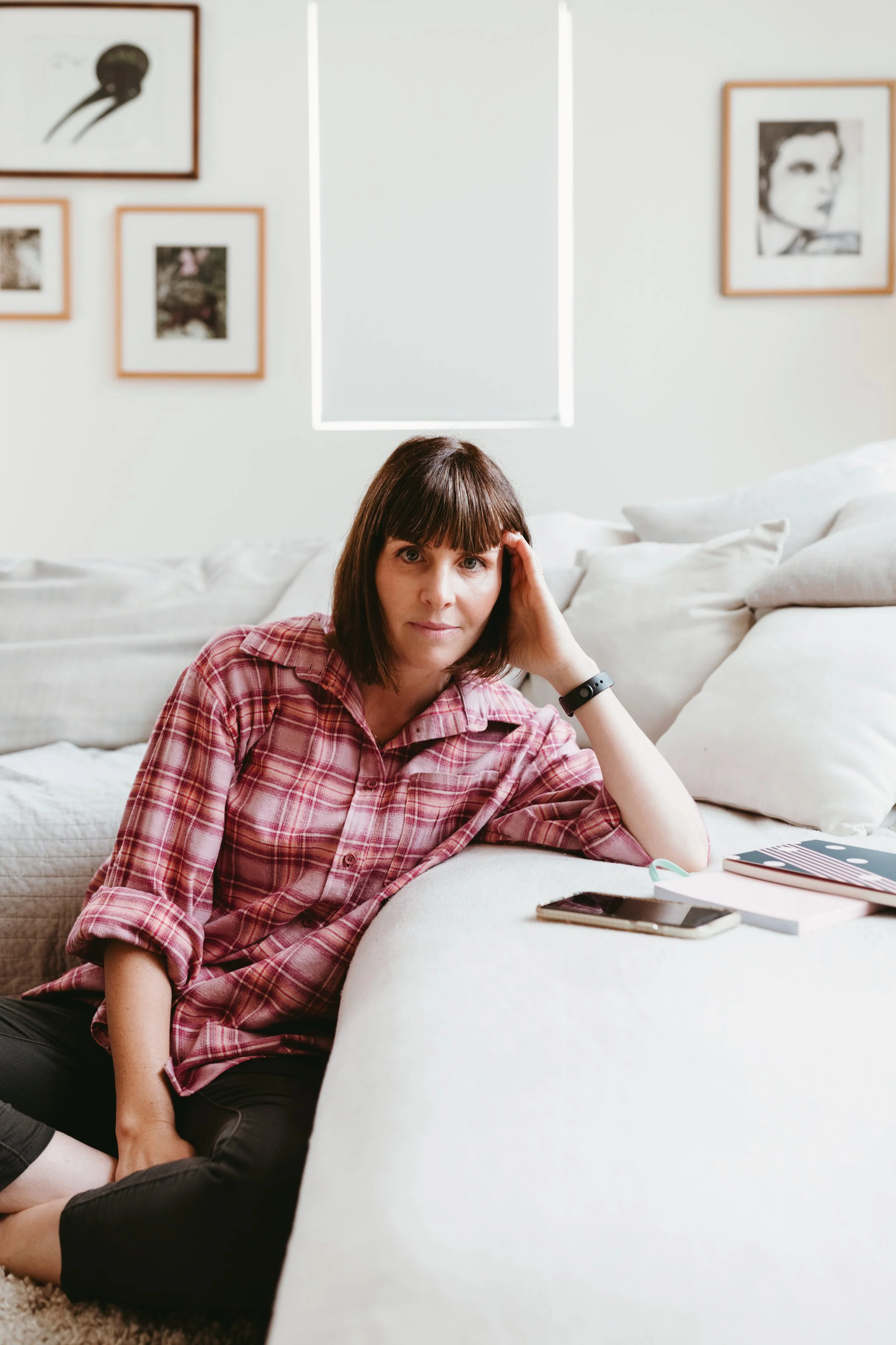 Woman looks straight into camera for relaxed feel personal branding photography.