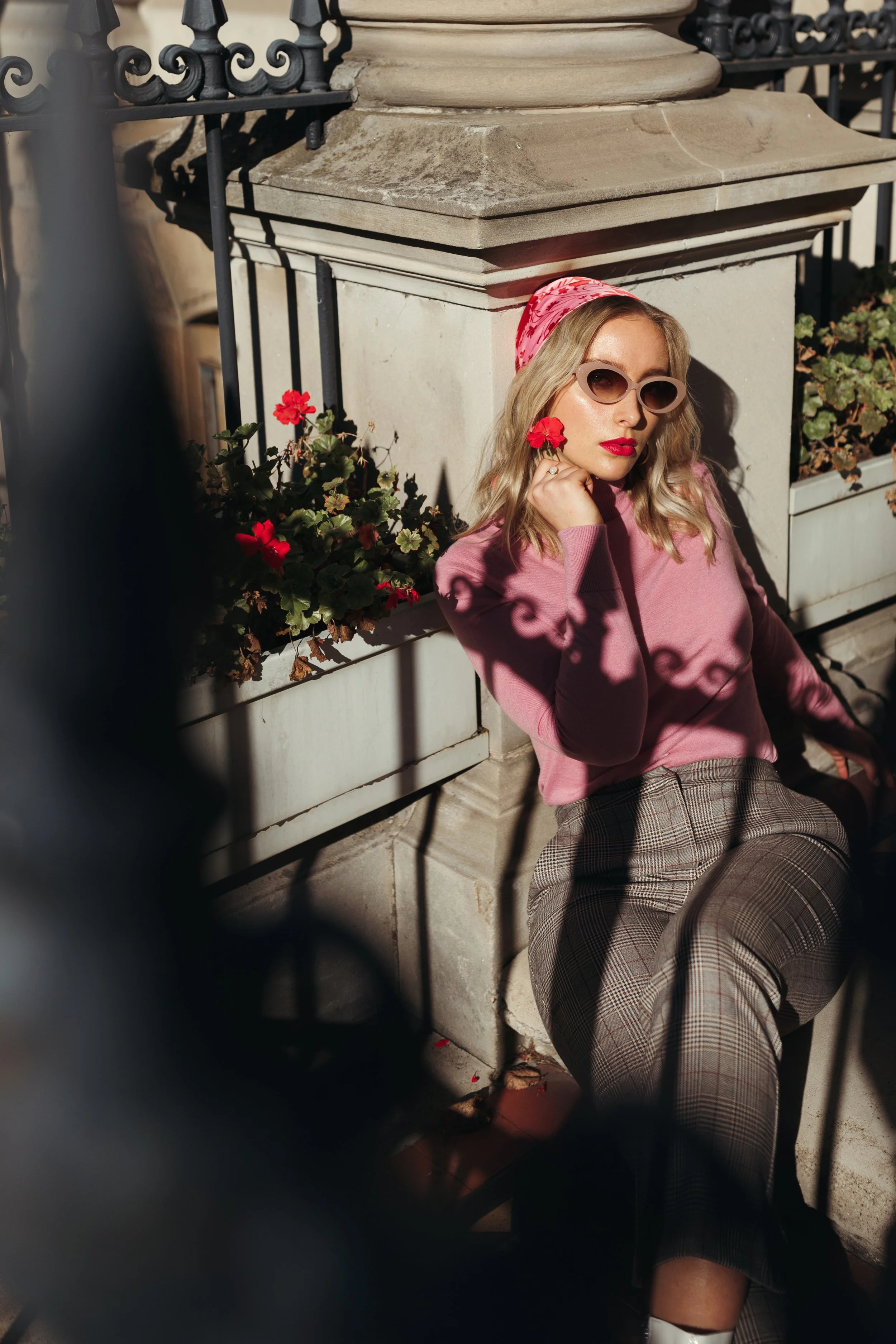 Model leans against pillar in Hobart photo shoot.