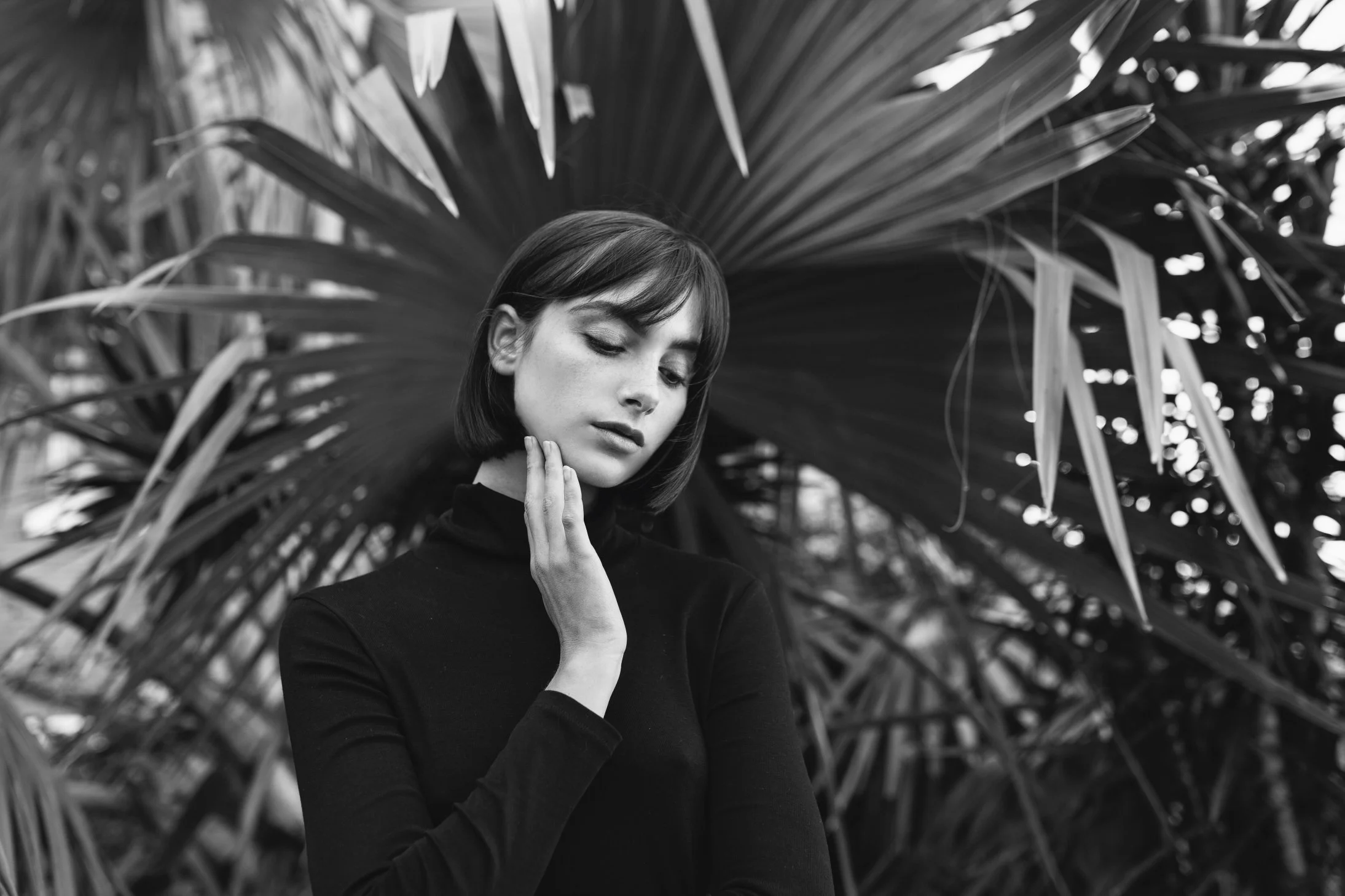 Model poses at garden photo shoot.