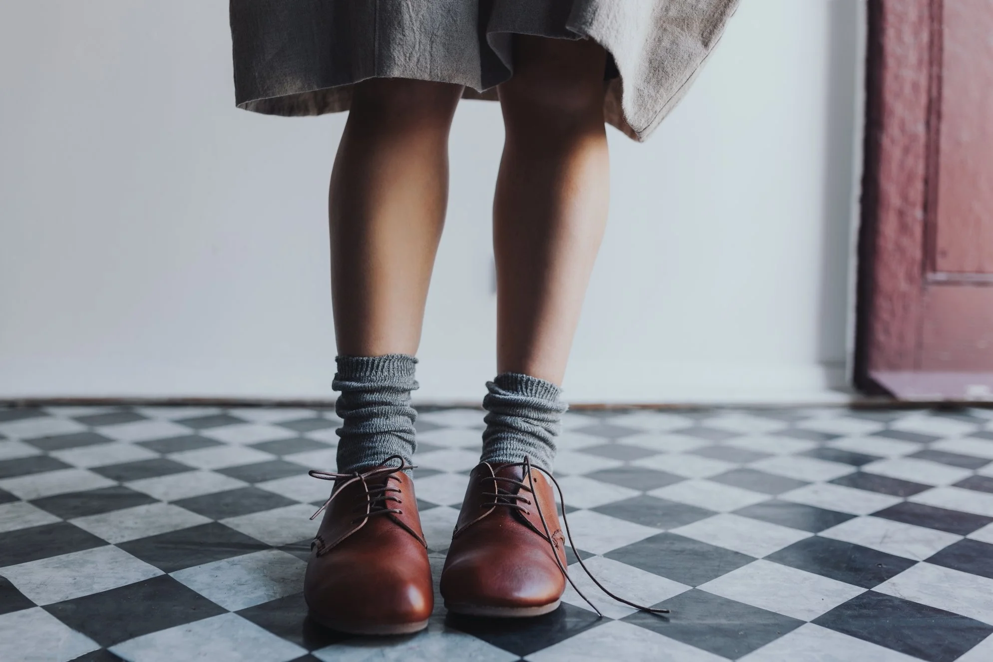 Leather shoes on model with one lace un-done during product photo shoot in Hobart.