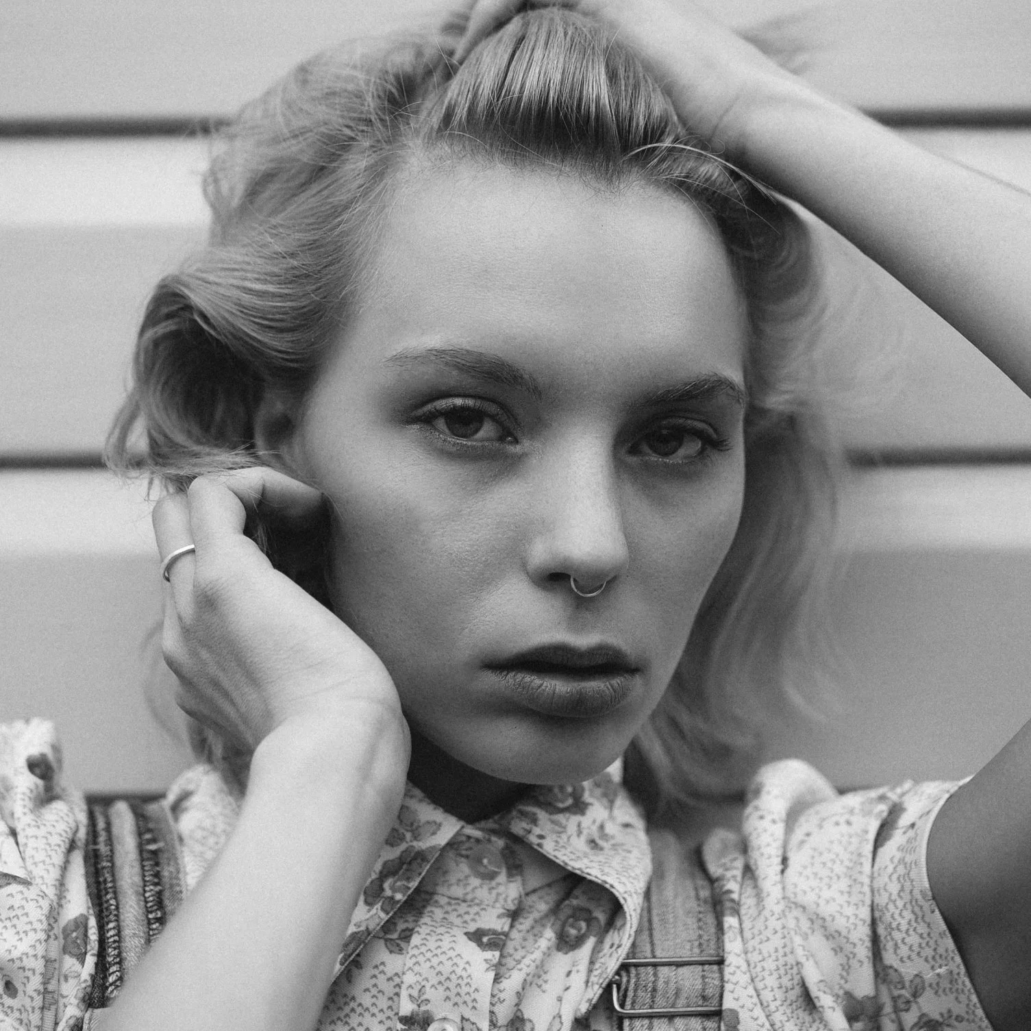 Close up portrait of model with ring through her nose.