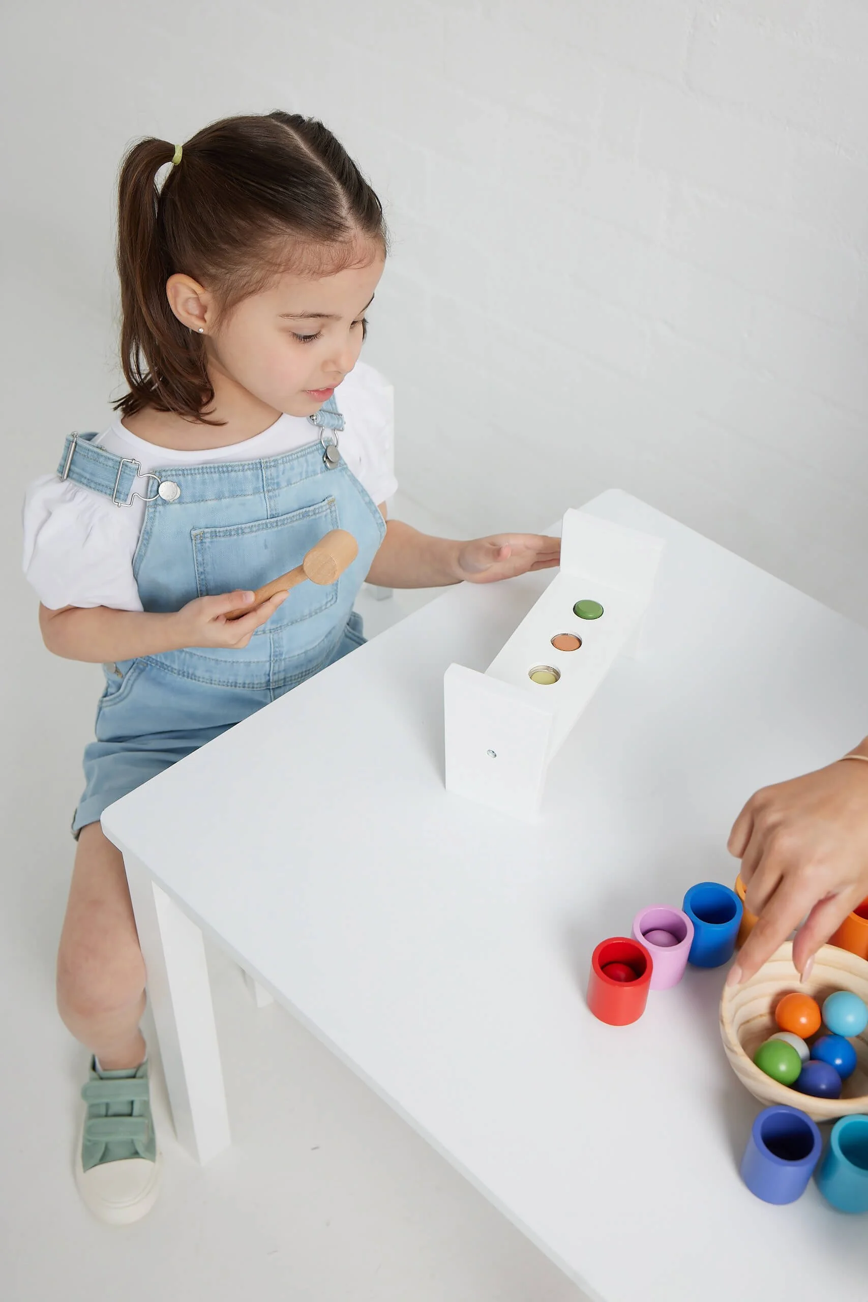 Child engaged in fine motor activity during a developmental therapy session in Adelaide