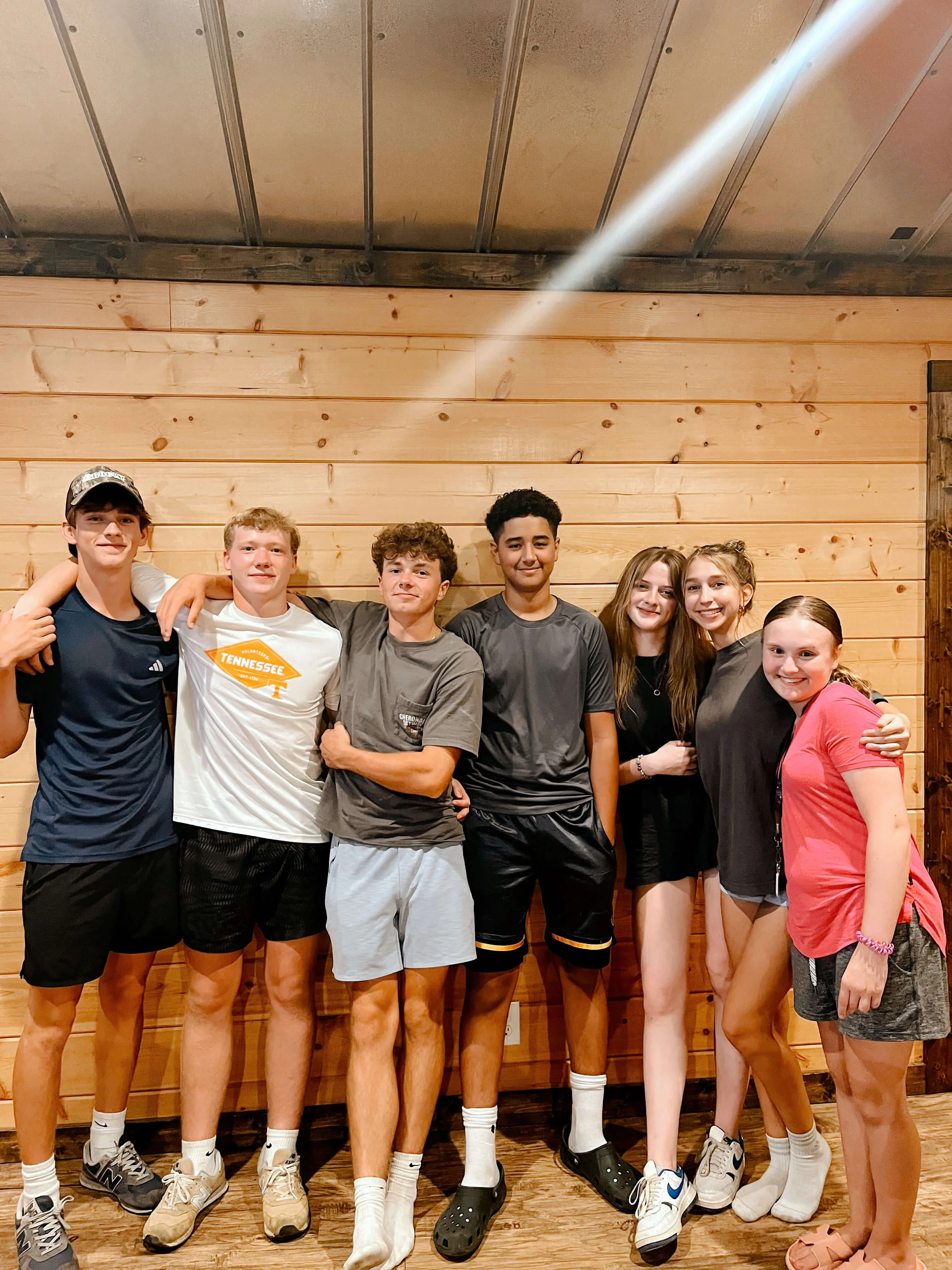 students hanging out indoors at retreat center