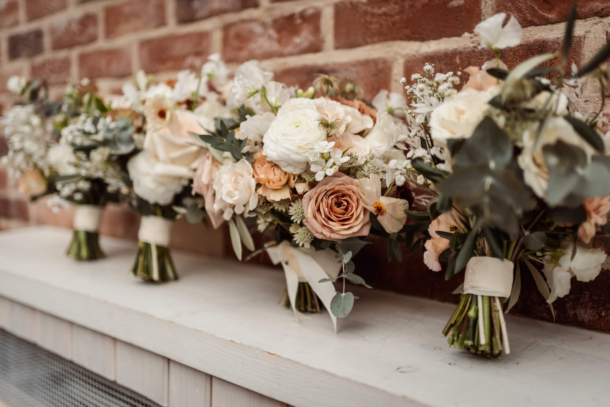 4 wedding bouquets for winter wedding at Foxtail Barns