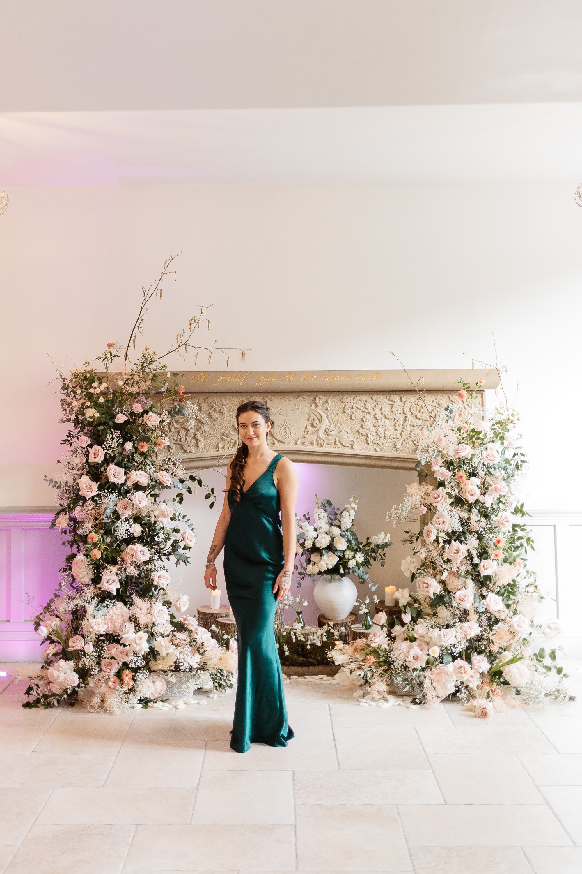 Bridesmaid in Emerald green with a floral backdrop