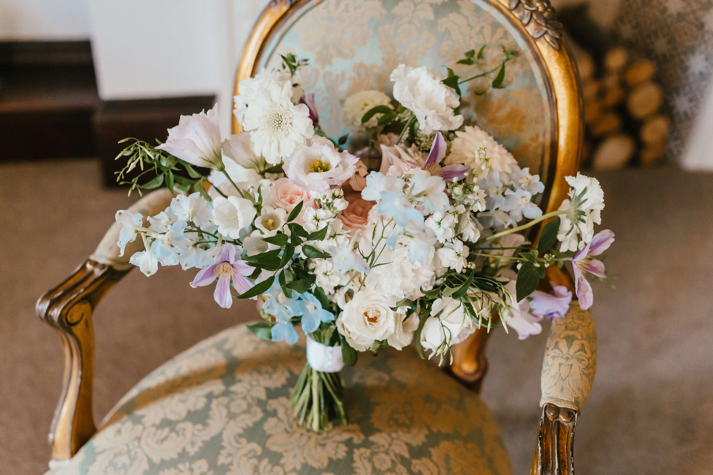 Luxurious elegant bridal bouquet of fresh flowers on french chair