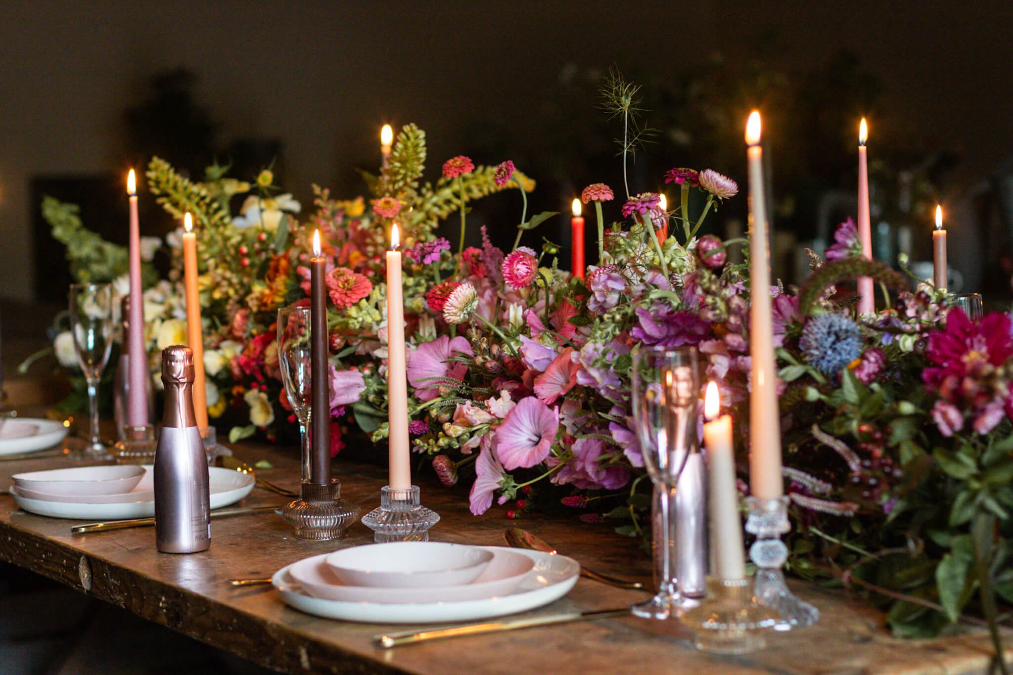 Ombré tablescape of brightly coloured with champagne bottles tiny.jpg