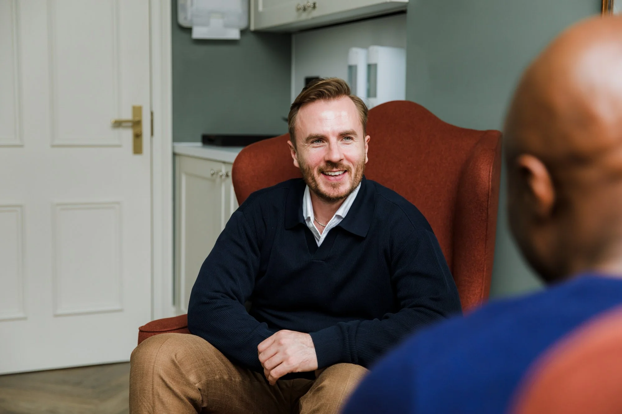 Men's sex therapist with a black male client