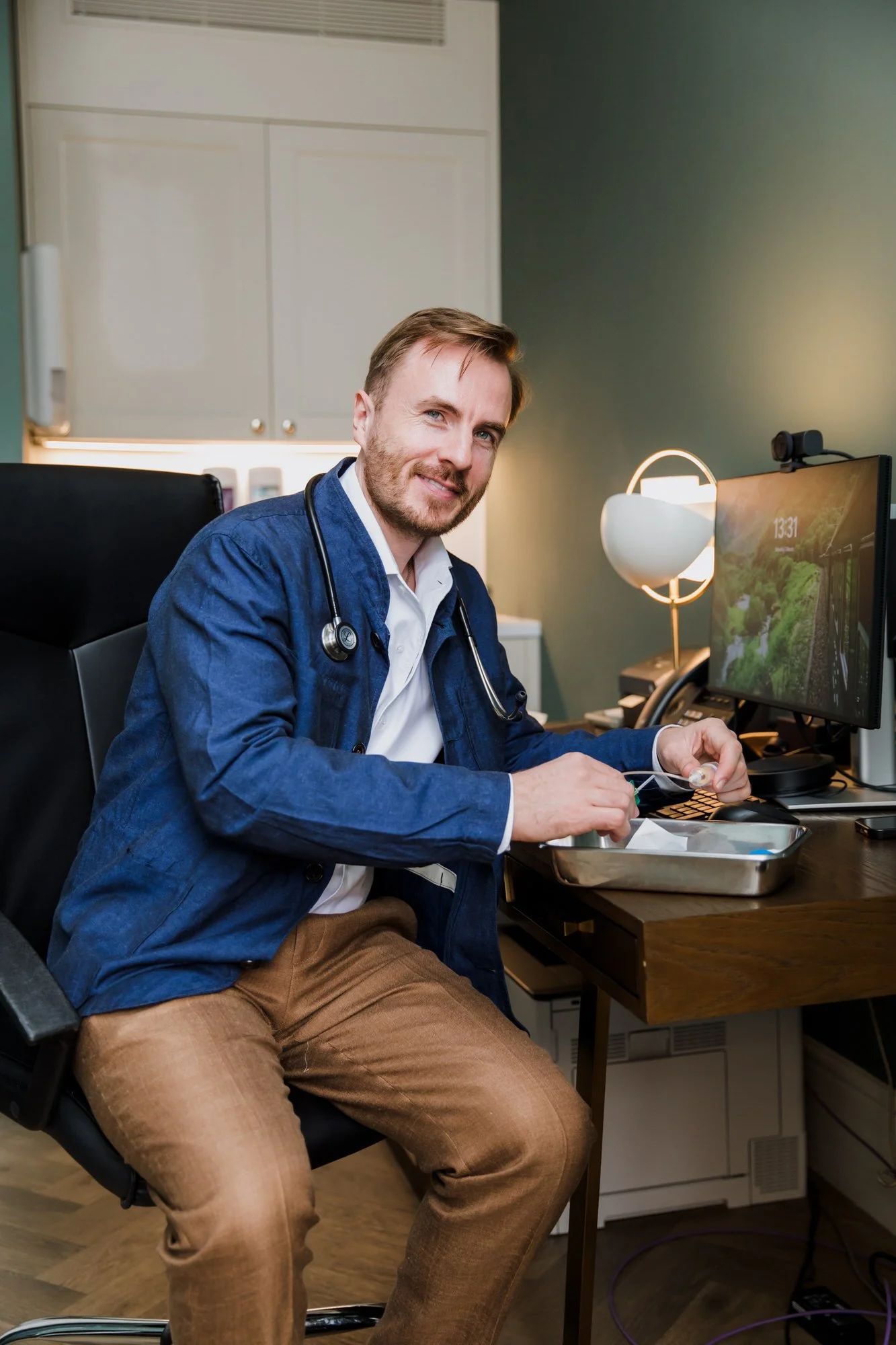 Men's Health GP with a stethoscope performing blood tests for testosterone