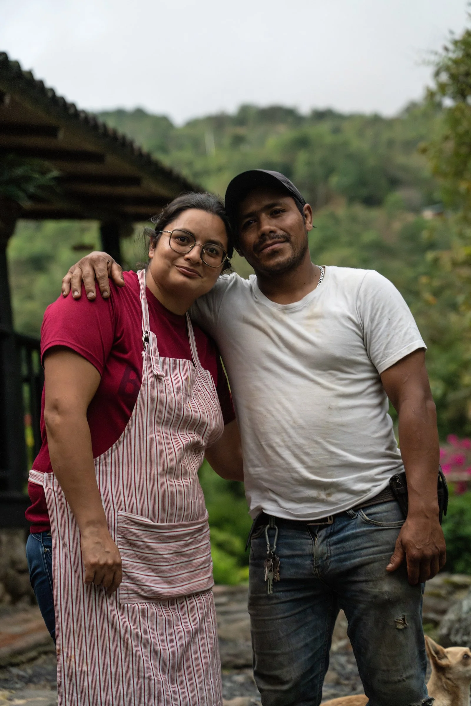 Two Finca Gualiva team members standing together at WhereNext Travel’s rainforest retreat and coffee farm near Bogotá, Colombia.