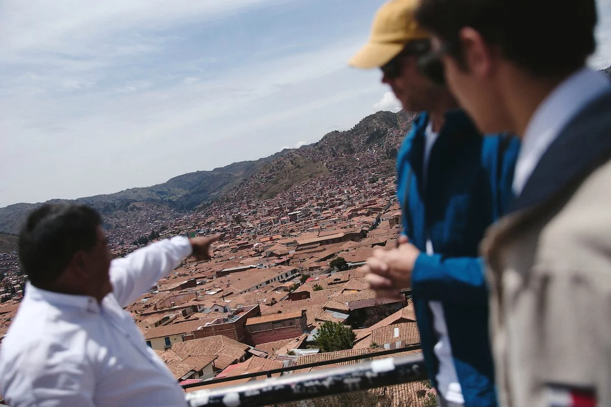 WhereNext Travel guests walking through Cusco, Peru with a local guide during a privately operated cultural tour.
