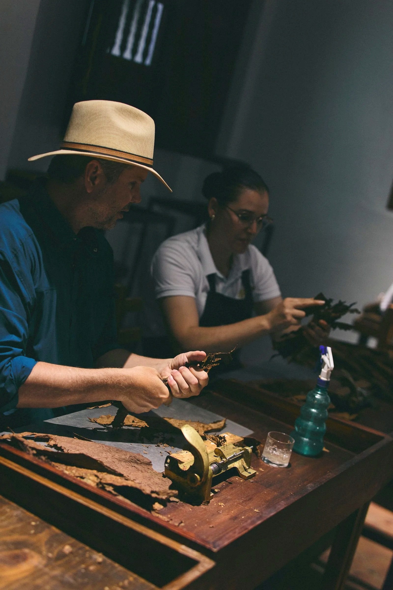 A Tobacco Road WhereNext Original experience guest hand wraps a cigar in Barichara, Colombia.
