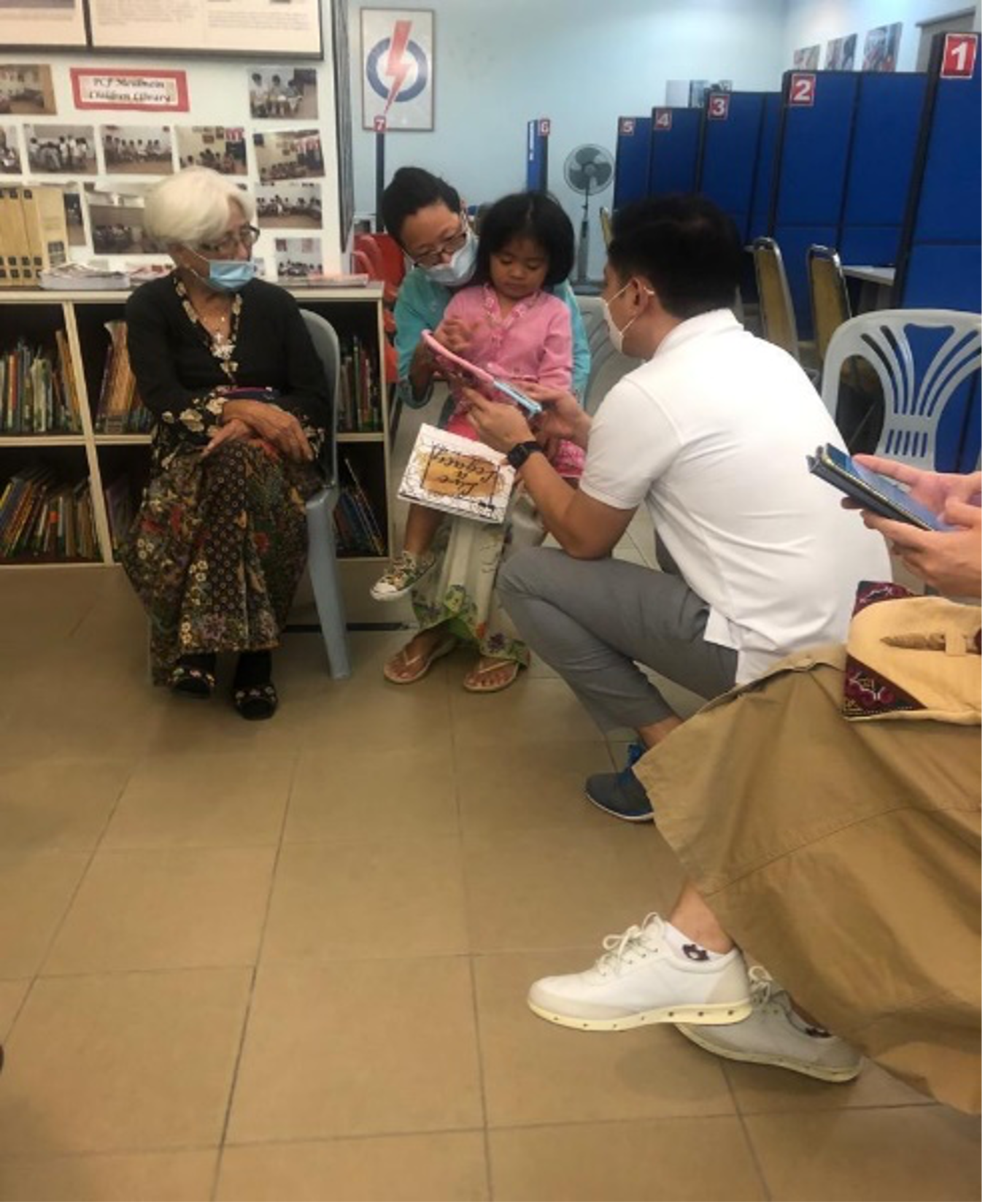 Adviser reading to the youngest present