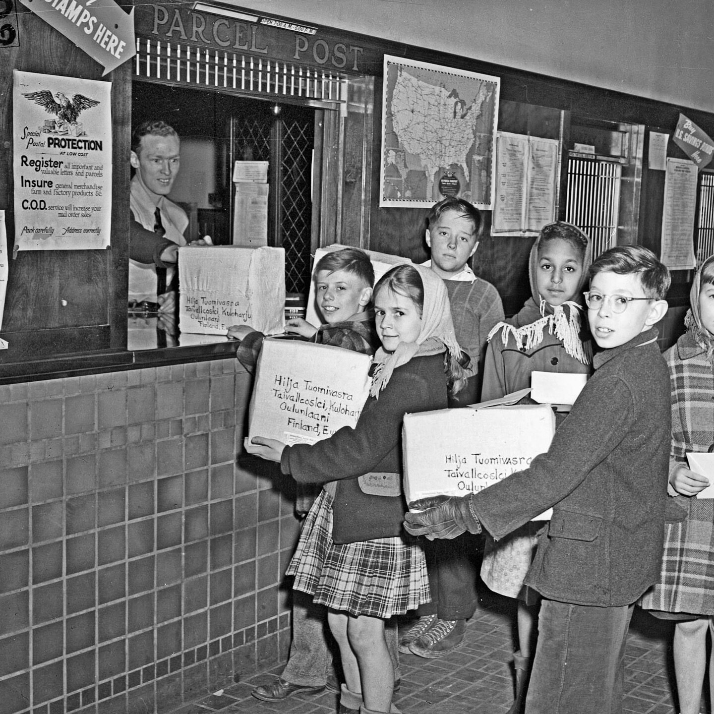 1947 - Local kids take packages to the Delhi Post Office. The packages contained items to help the people of Finland. We also have desks available. Stay warm folks.