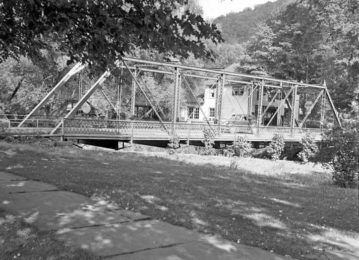 1940 View of the Kingston Street Bridge in Delhi, NY with the building in the background.