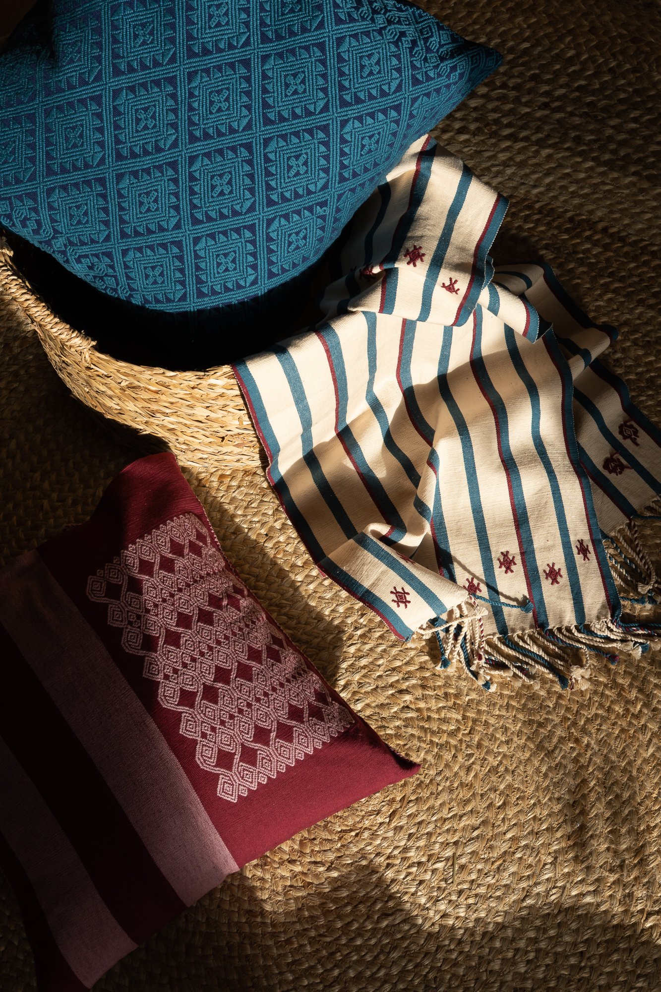 Lifestyle: Teal Zuma Brocade Handwoven Cushion, Styled with Stripe Runner Handwoven by Indigenous Mayan Communities in Mexico - Routes Interiors