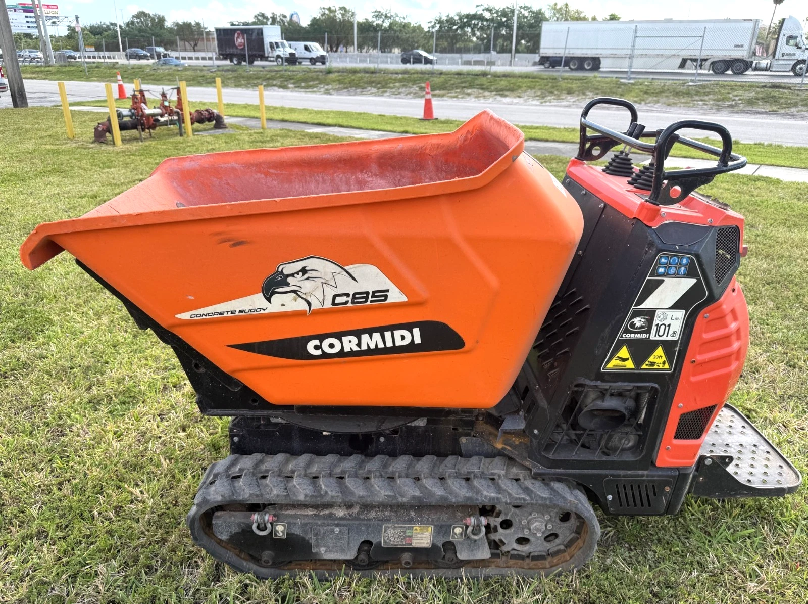 Used Cormidi C13.85 concrete dumper on lawn