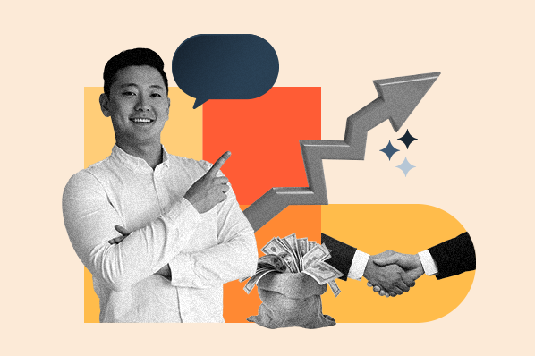 An Asian person pointing to business graphics