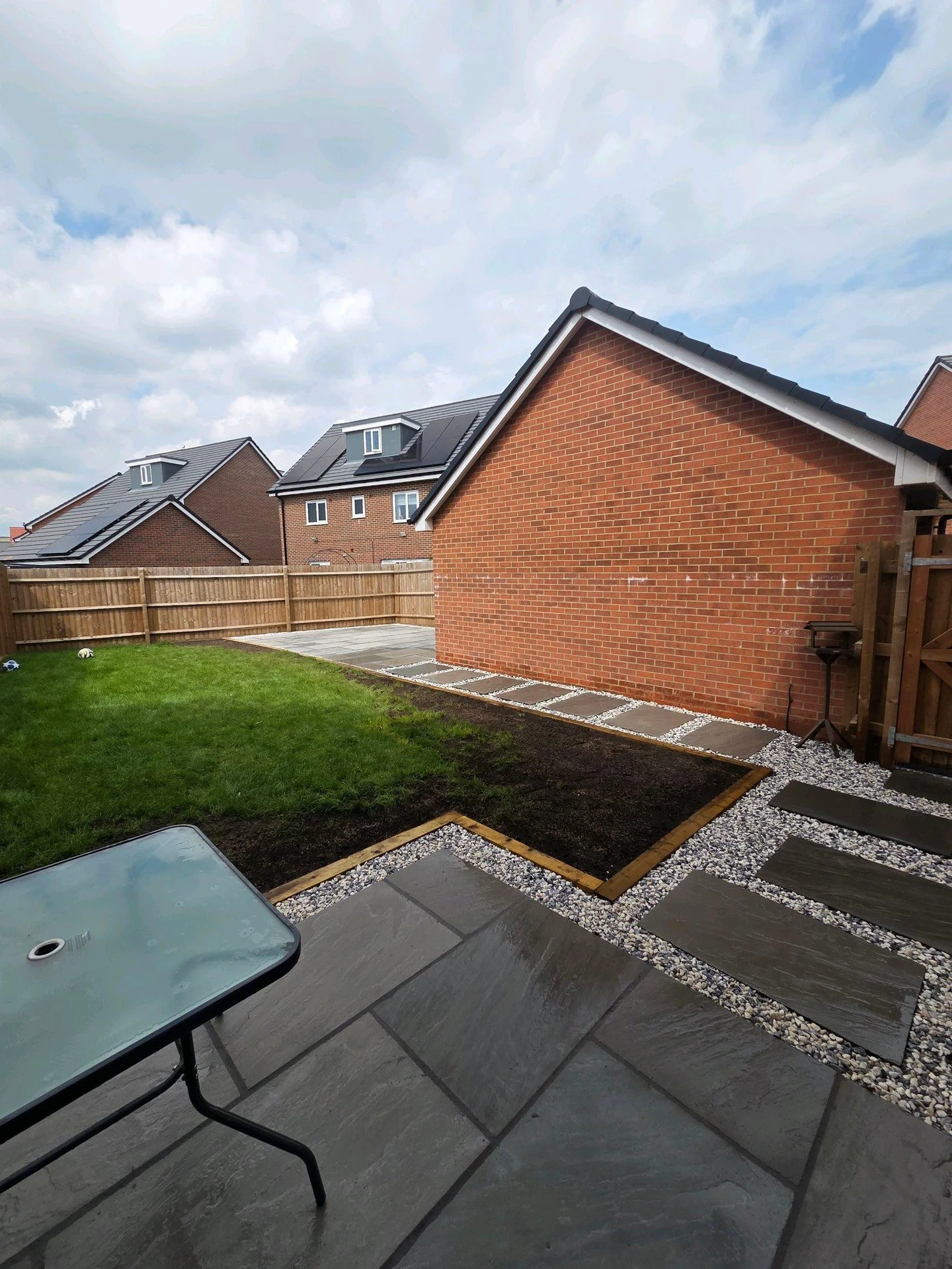 Another full garden transformation we completed for a really lovely client in Nuneaton. 

54sqm over two seperate patios of large format 600x900mm Indian sandstone on Kandla grey, sleeper edging around the lawn and a stepping stone pathway. 

Creatin