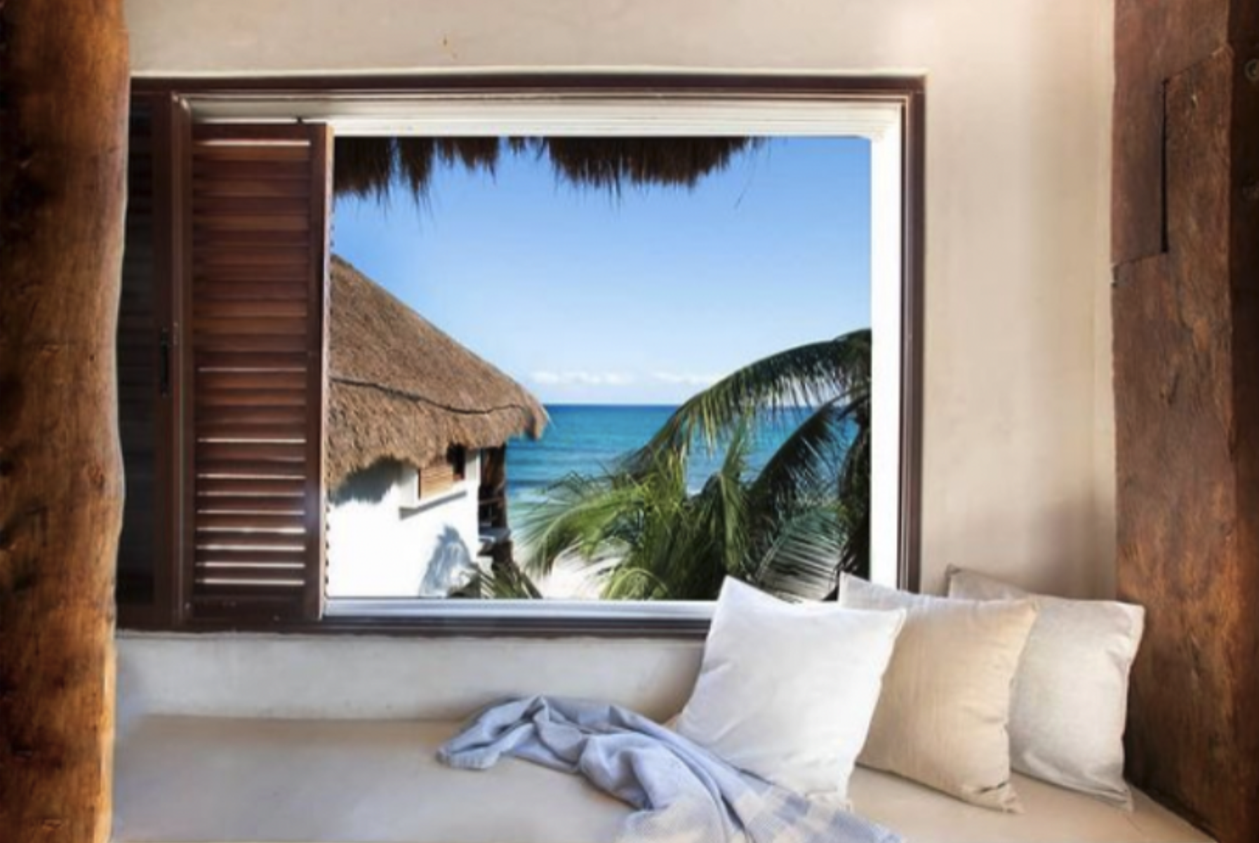 Bed in a Double Beach View Room 1.png