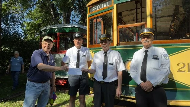 Before our two-trolley charter on August 9, 2025, Chapter president Bob Brewster presented a P-R-O Fund check to officials of the Fort Collins Trolley.