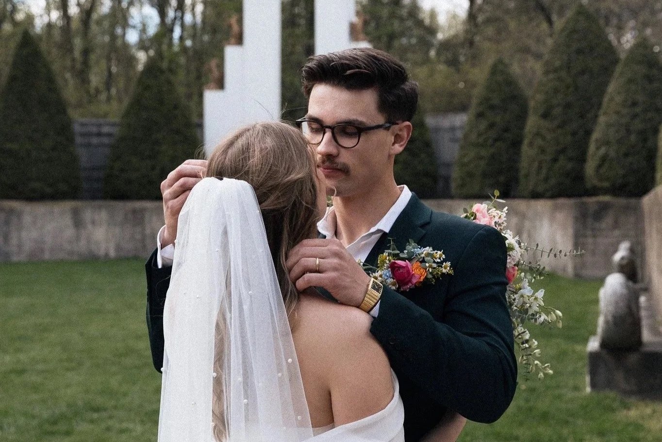Bride and groom share a silent moment during their first look at Allerton Mansion