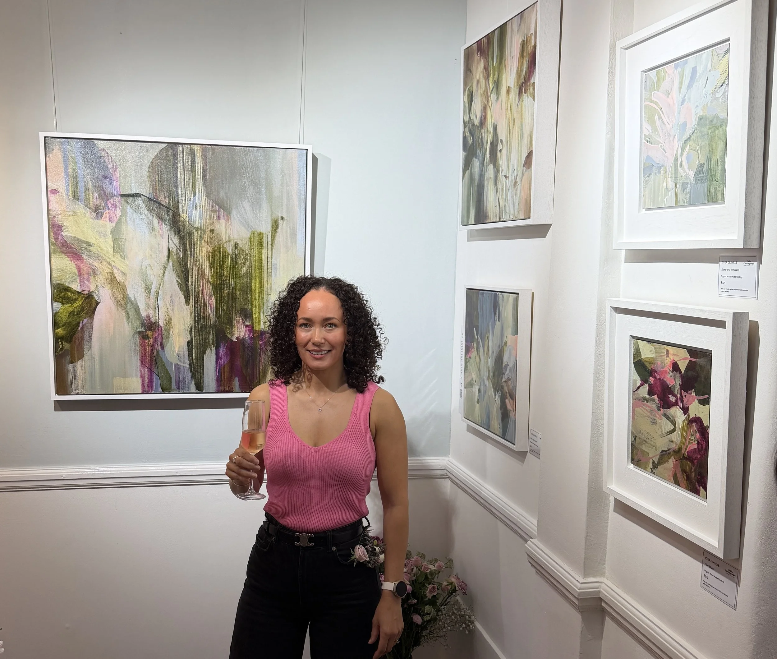Artist Cher Deaville with floral abstract paintings at Dalloz Contemporary