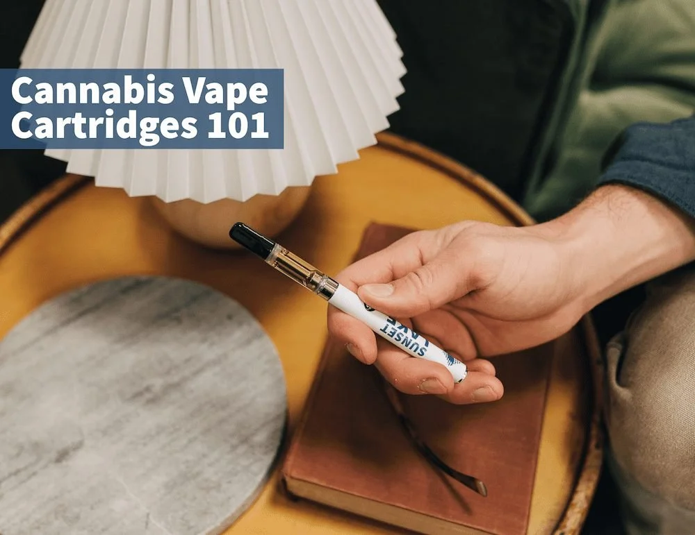 Photo of a hand holding a Sunset Lake Cannabis vape pen next to a side table with a book and a lamp. Text says, "Cannabis Vape Cartridges 101"