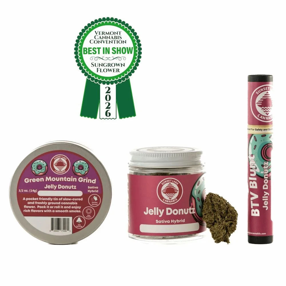 Photo of group of Sunset Lake Cannabis Jelly Donutz products. Above the products is a green ribbon award for Best In Show Sungrown Flower at the 2026 Vermont Cannabis Convention.