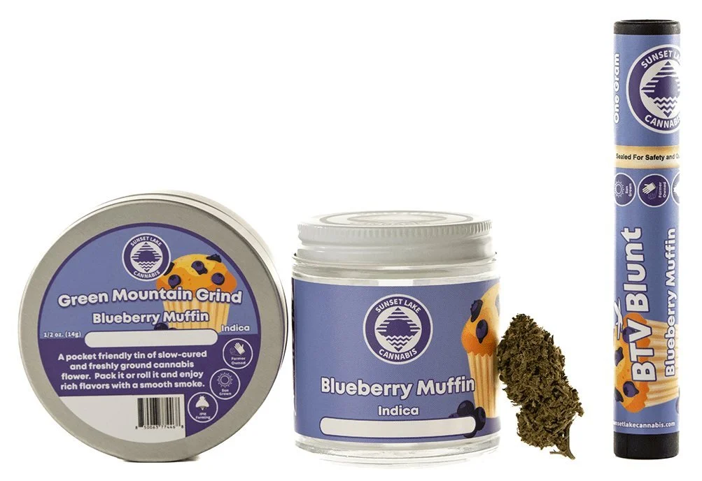 Blueberry Muffin strain products from Sunset Lake Cannabis in Vermont including a tin of Green Mountain Grind, hand-trimmed flower, and a BTV Blunt preroll.
