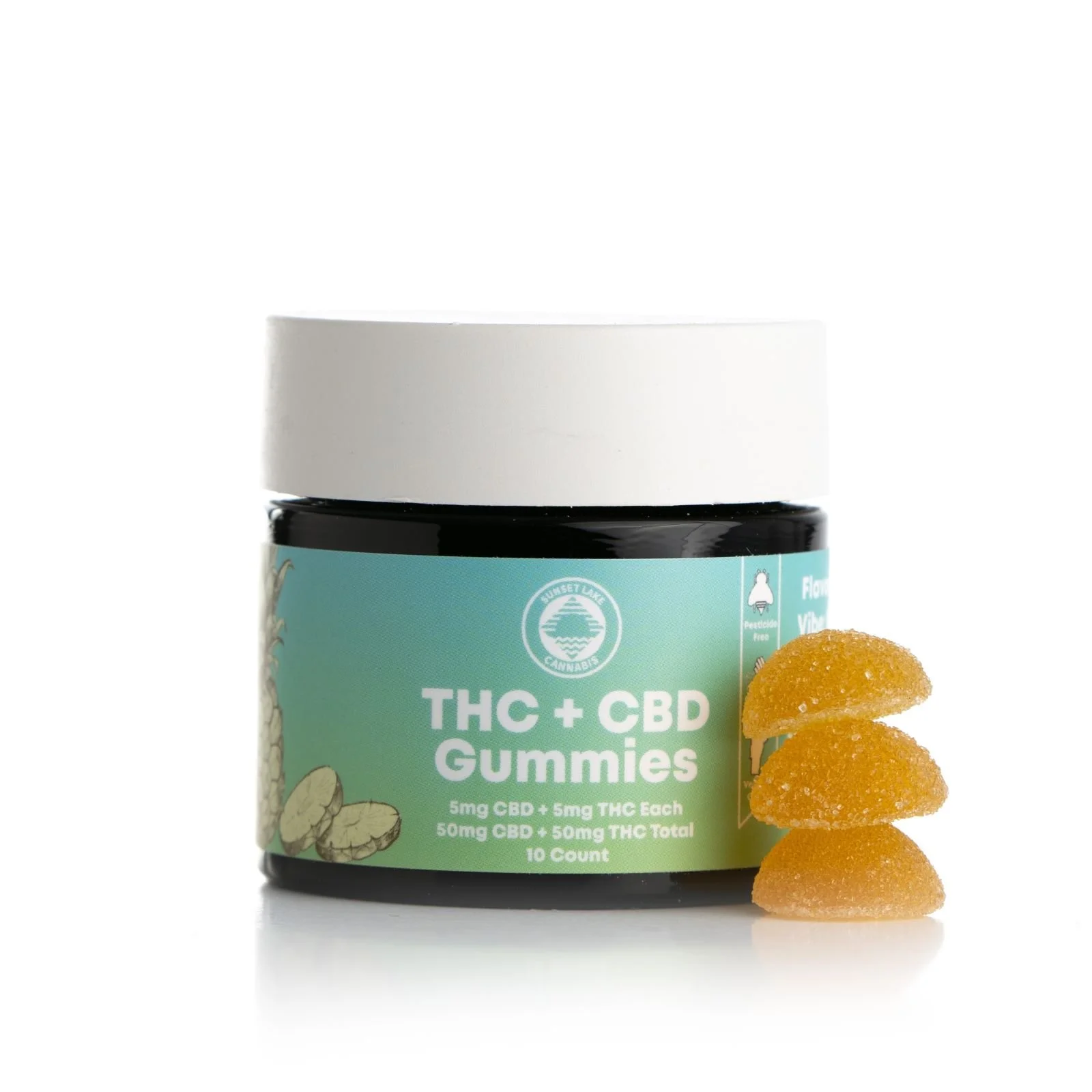 A black-glass, white-capped child resistant jar of 1:1 THC and CBD gummies. The green-blue gradient label reads "Sunset Lake Cannabis, THC+CBD Gummies, 5mg CBD + 5mg THC Each, 50mg CBD + 50mg THC Total, 10 count"