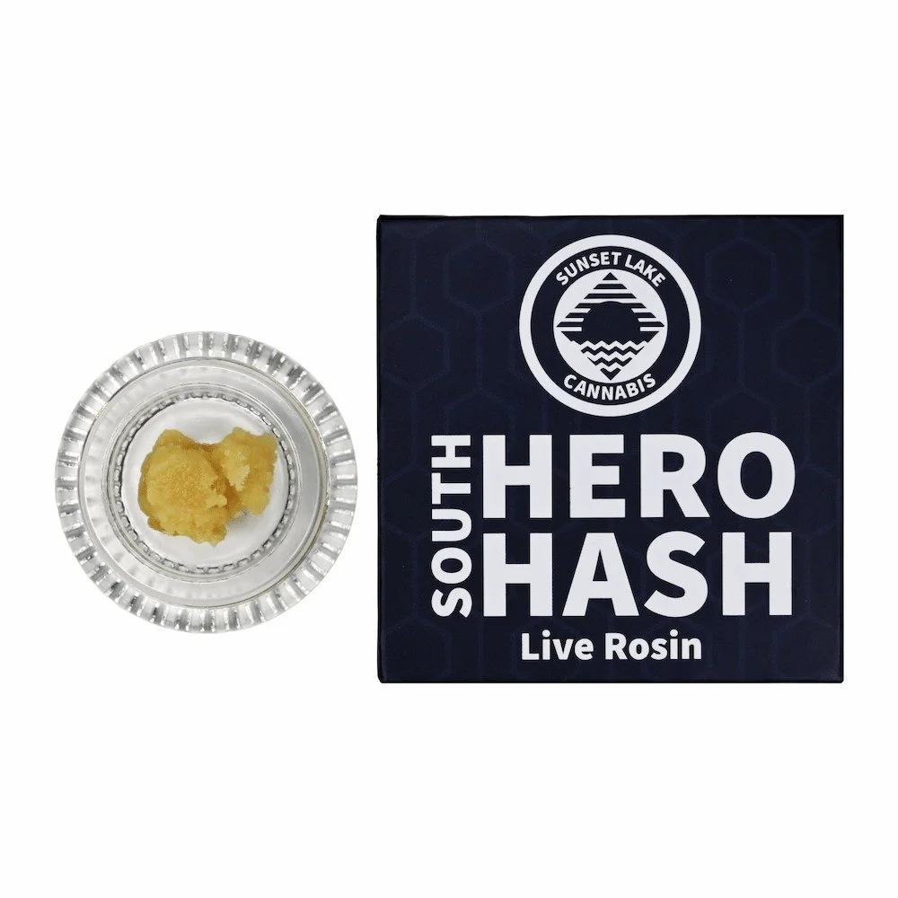 Photo of a box of Sunset Lake Cannabis South Hero Hash Live Rosin next to an open jar of rosin