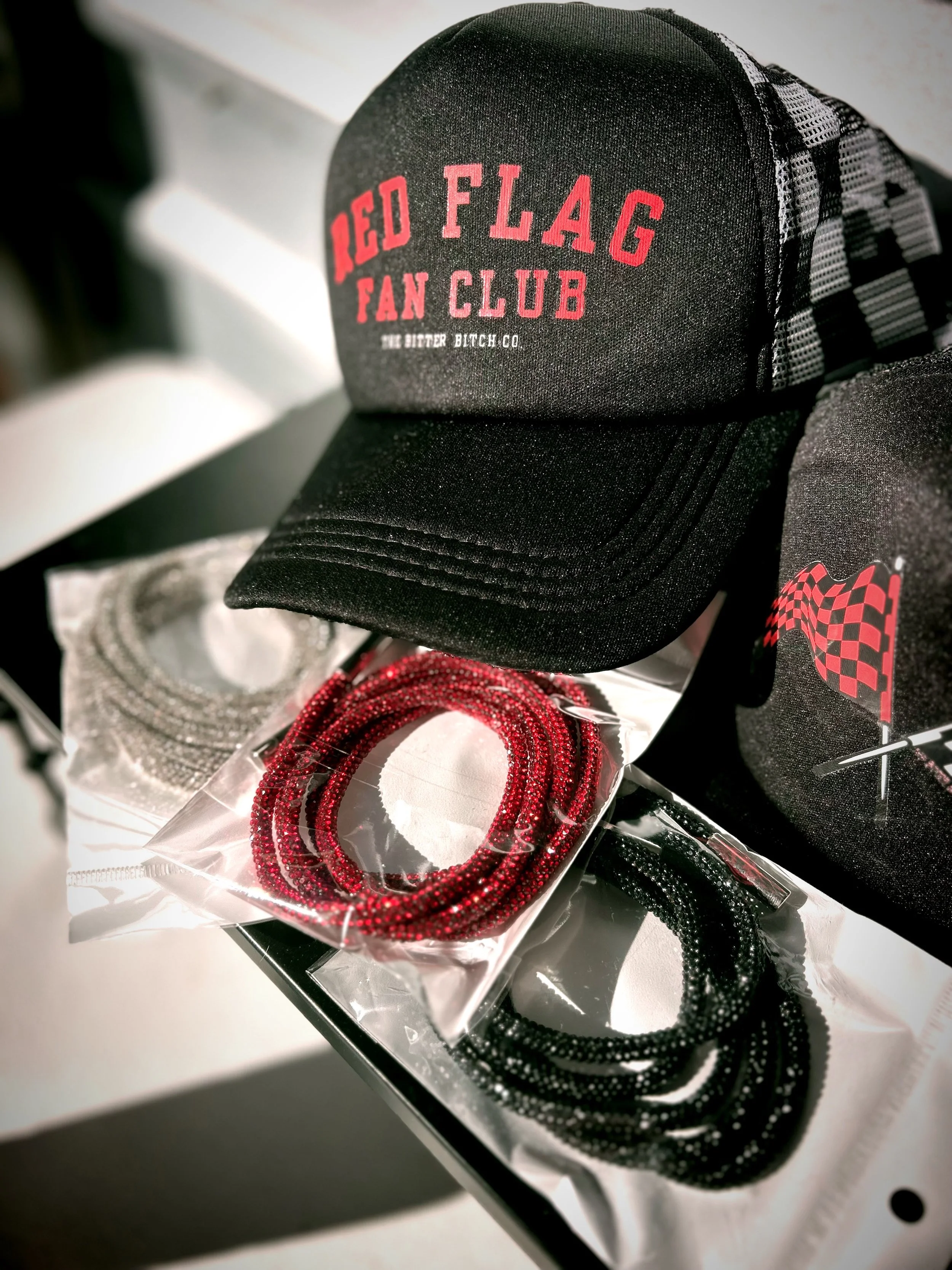 Red Flag Fan Club hoodie with signature checkered flag logo and rhinestone drawstring optional upgrade by The Bitter Bitch Co
