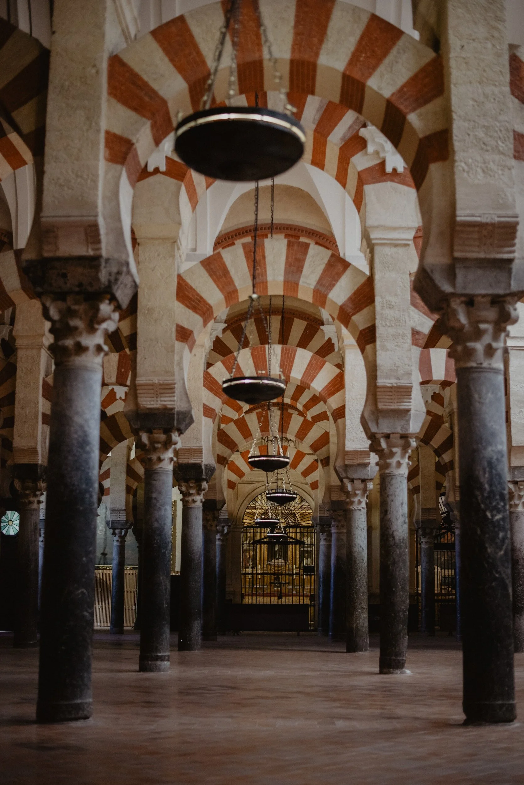 Red and white arches of Mezquita of Cordoba Spain travel guide