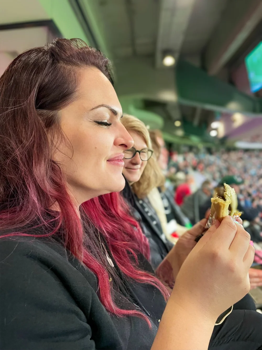 The Bitter Bitch eating a meat pie at Marvel Stadium, Melbourne Australia