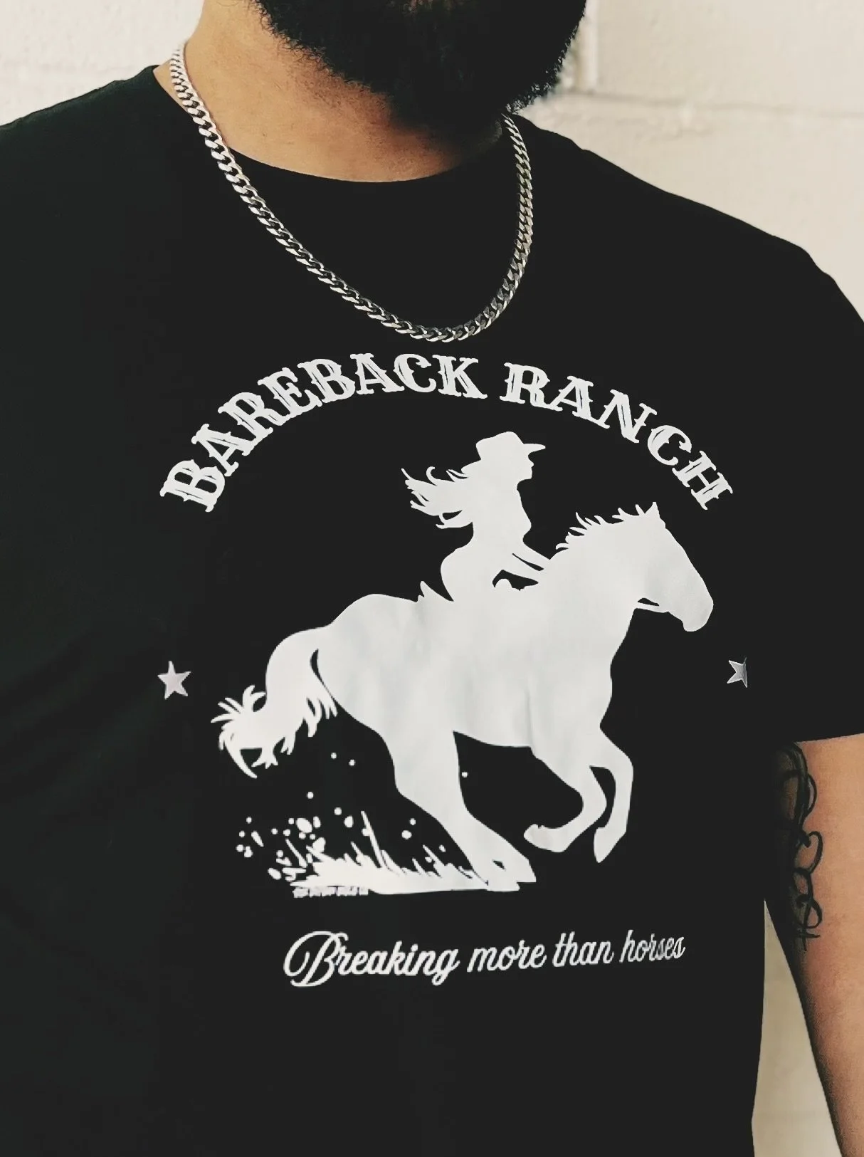 Bareback Ranch: Breaking more than horses unisex tee in black with bold white graphic, by The Bitter Bitch Co.