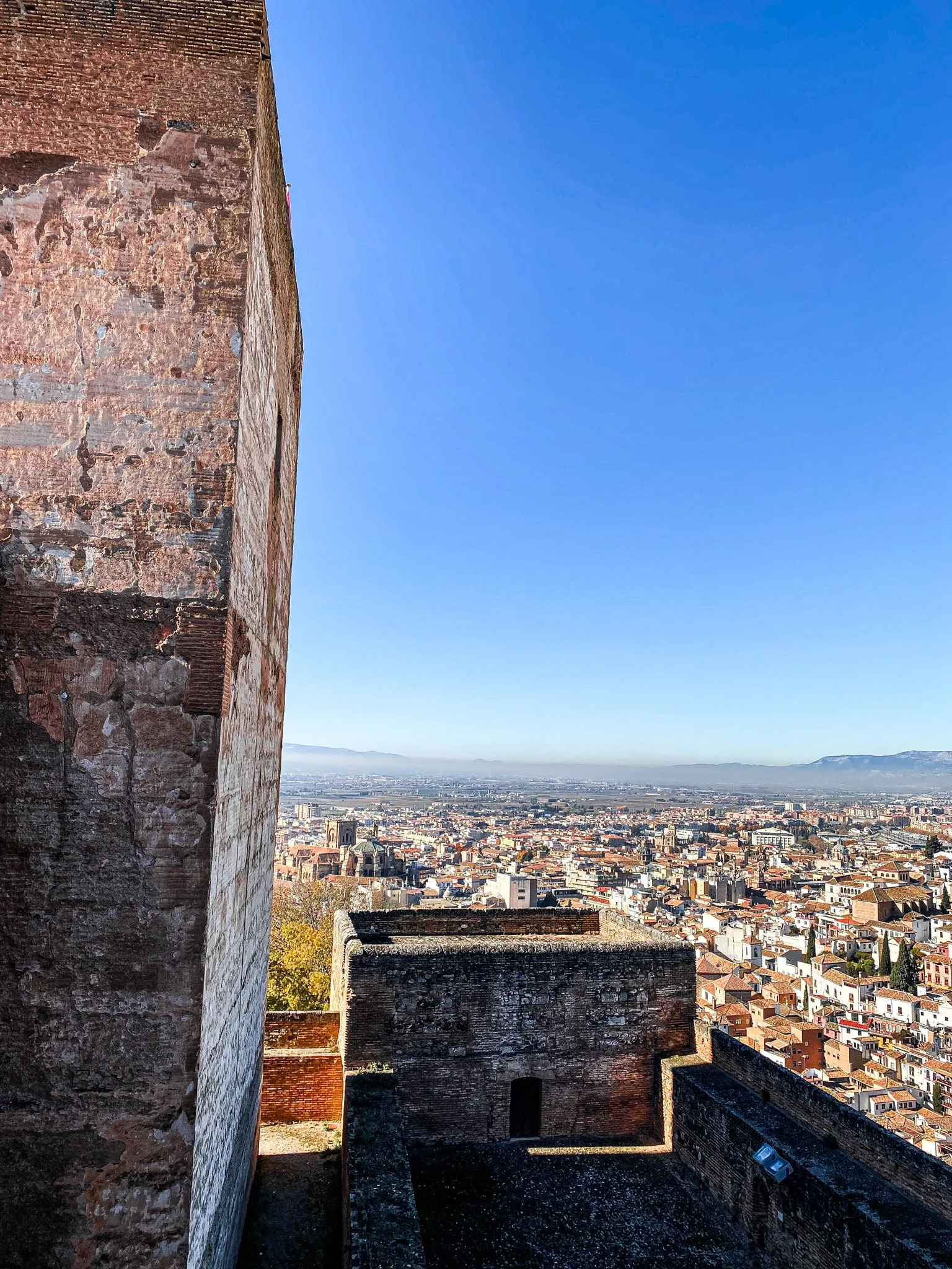 view of the city of granada from Torre de la Villa viewpoint.  best sunset spots in Granada Spain