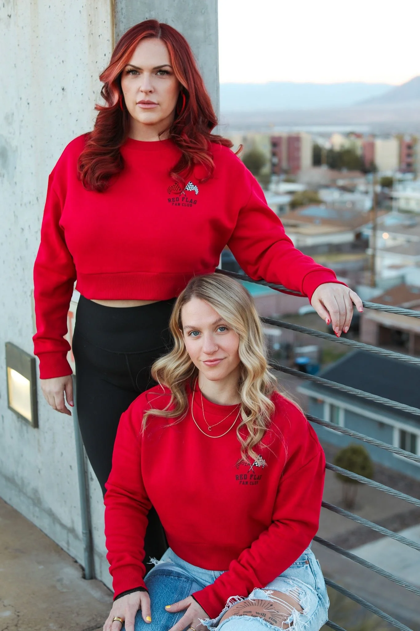 Red Flags Fan Club cropped crewneck sweatshirt in red with the "red flags" signature checkered flag logo on the left front breast by The Bitter Bitch Co