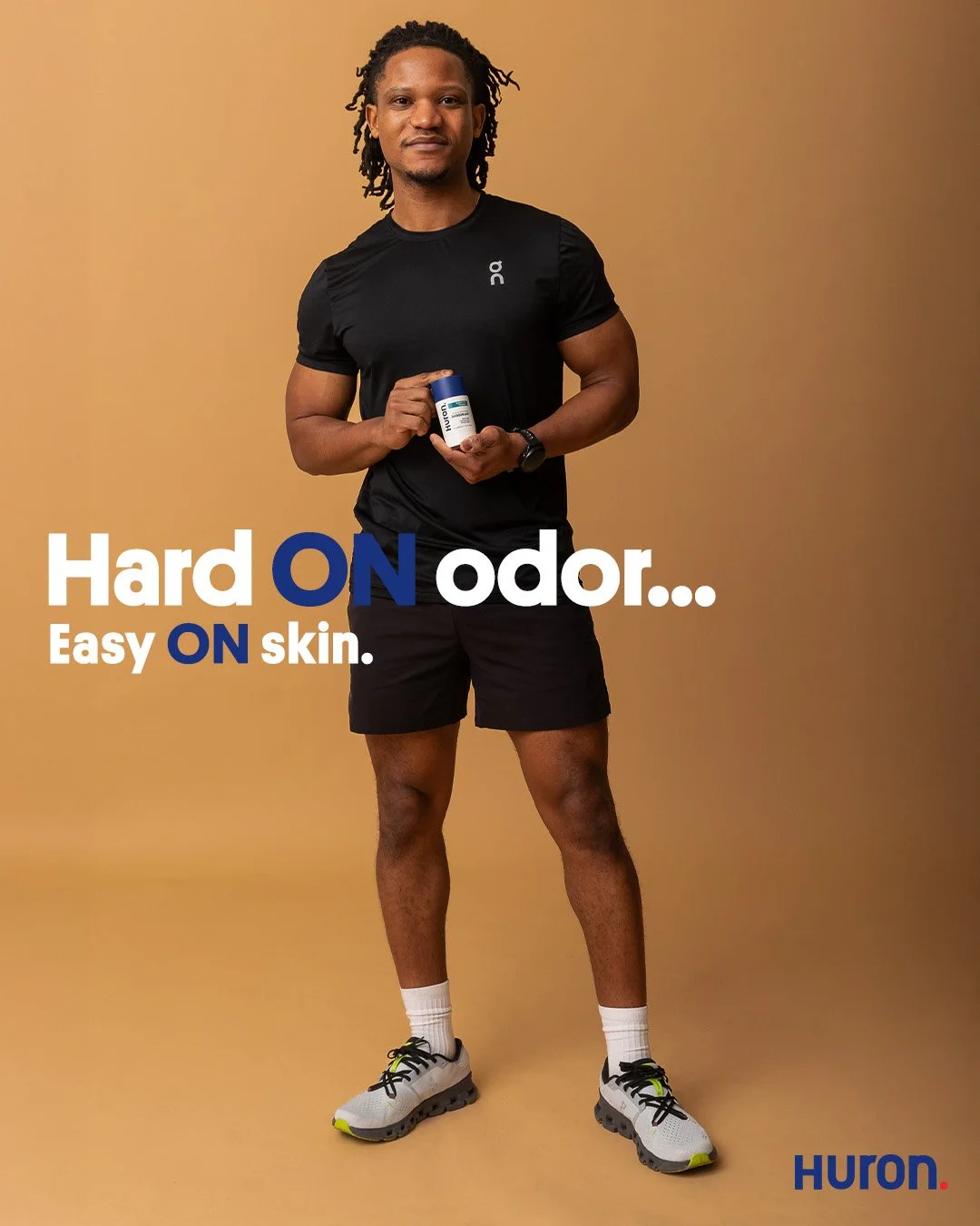 Commercial grooming advertisement for Huron featuring a male athlete in athletic apparel. High-end editorial photography focusing on product placement and brand recognition without visual clutter.