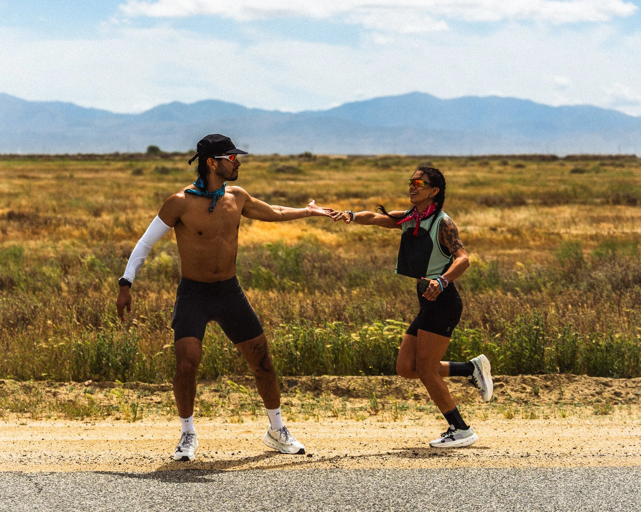 Female tagging in male On Running athlete — The Speed Project running photographer Chicago