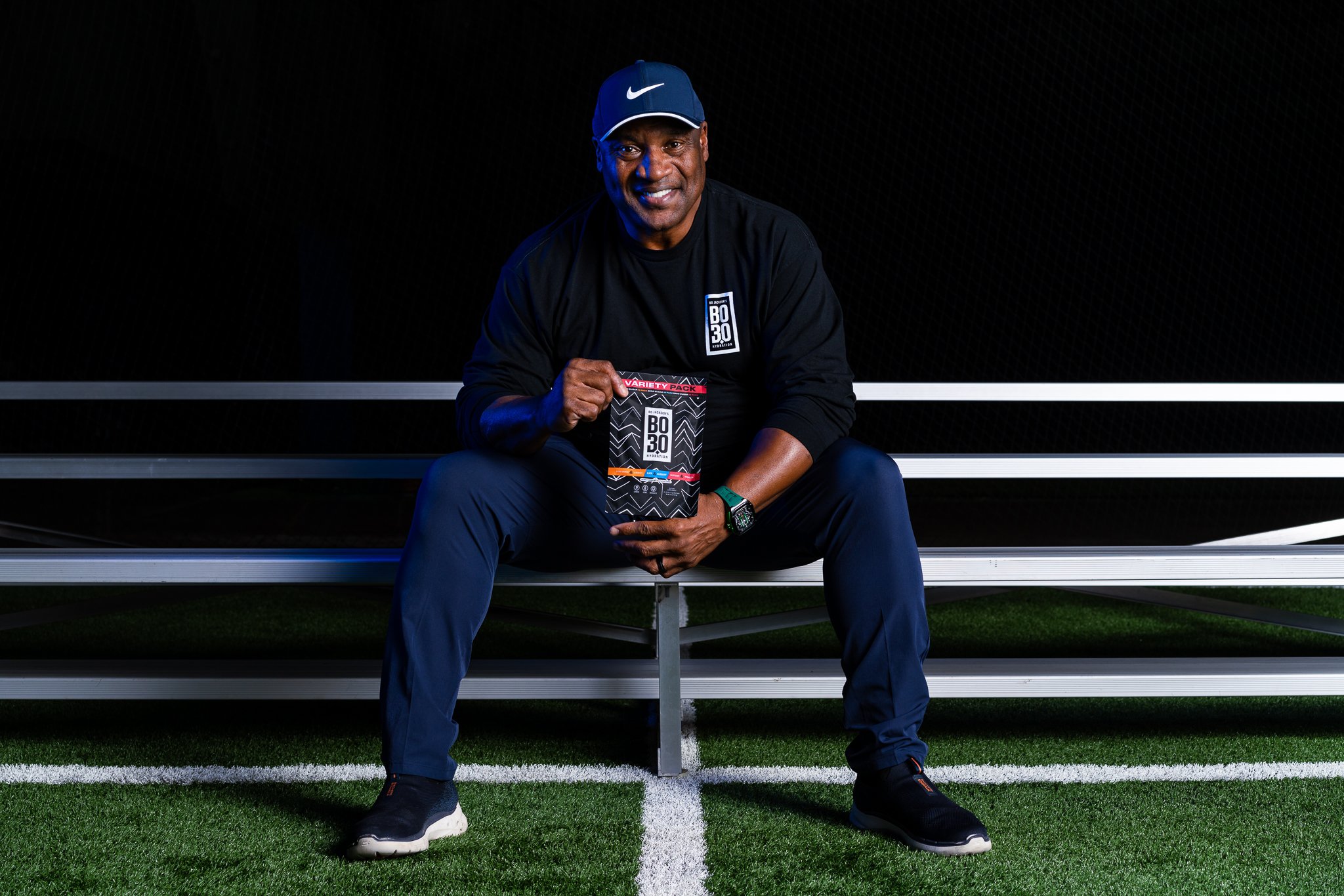 Bo Jackson holding electrolyte package — athletic brand campaign photography