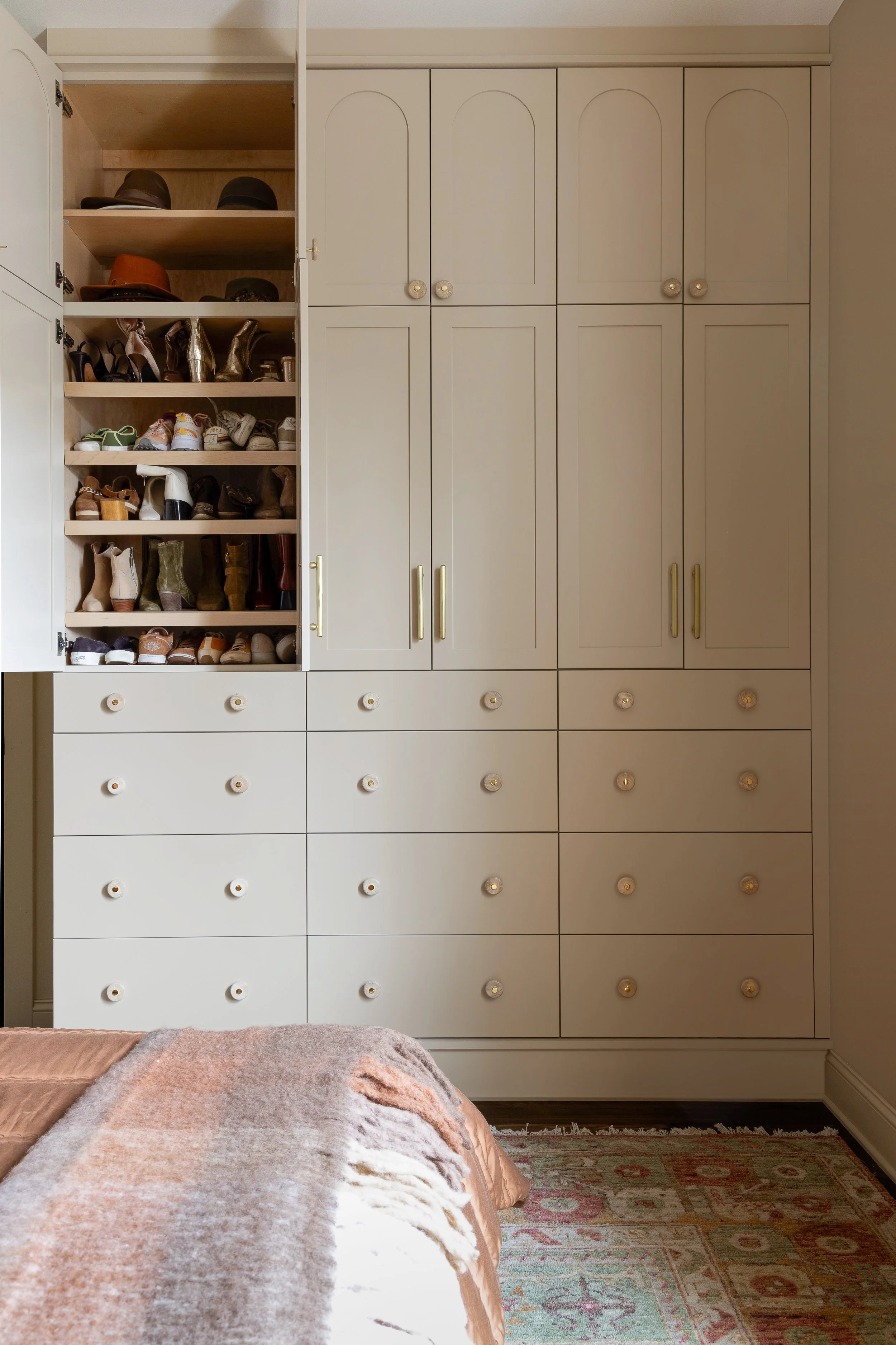 Custom Primary Bedroom wardrobe equipped with slanted shoe shelves