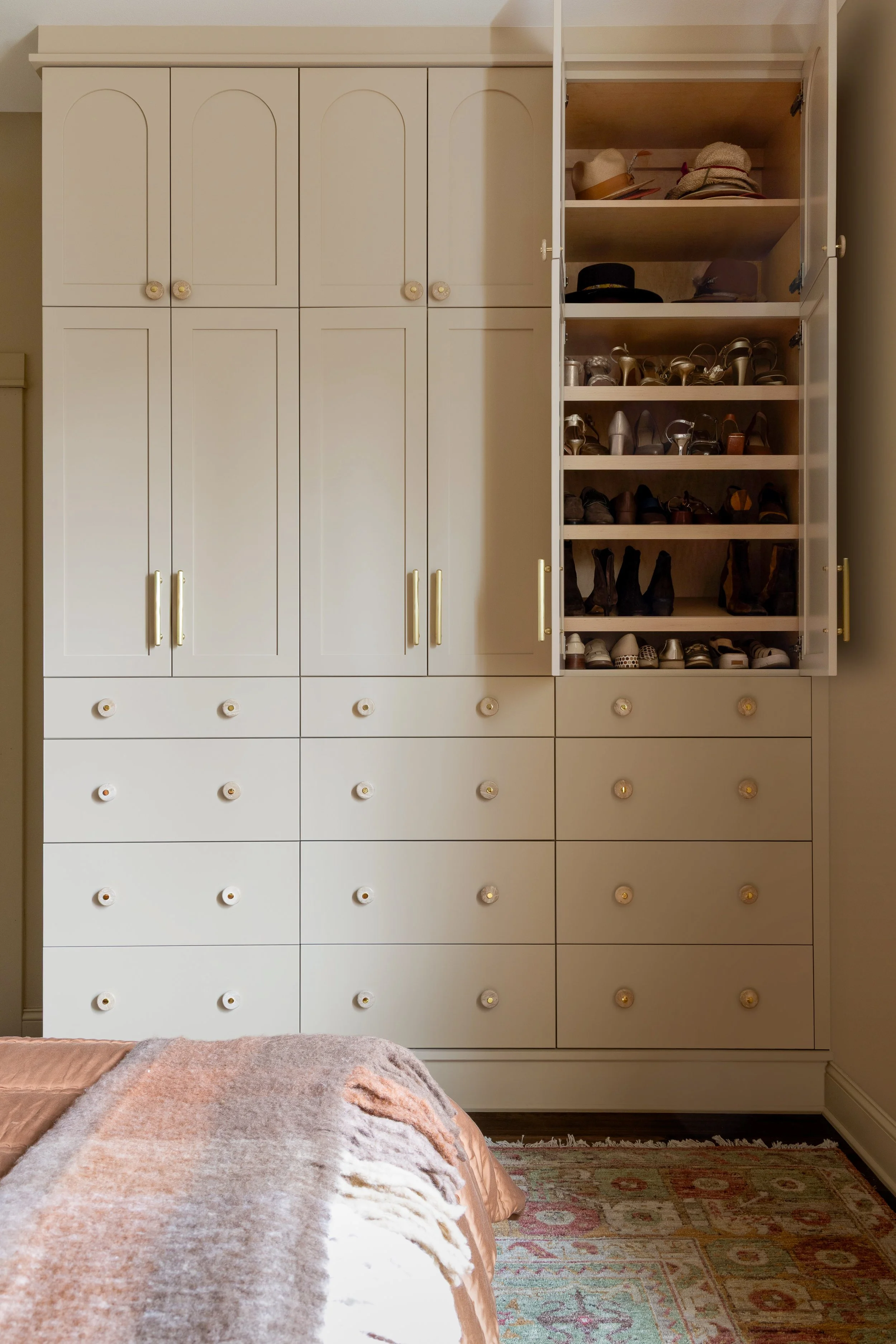 Custom Primary Bedroom wardrobe equipped with slanted shoe shelves