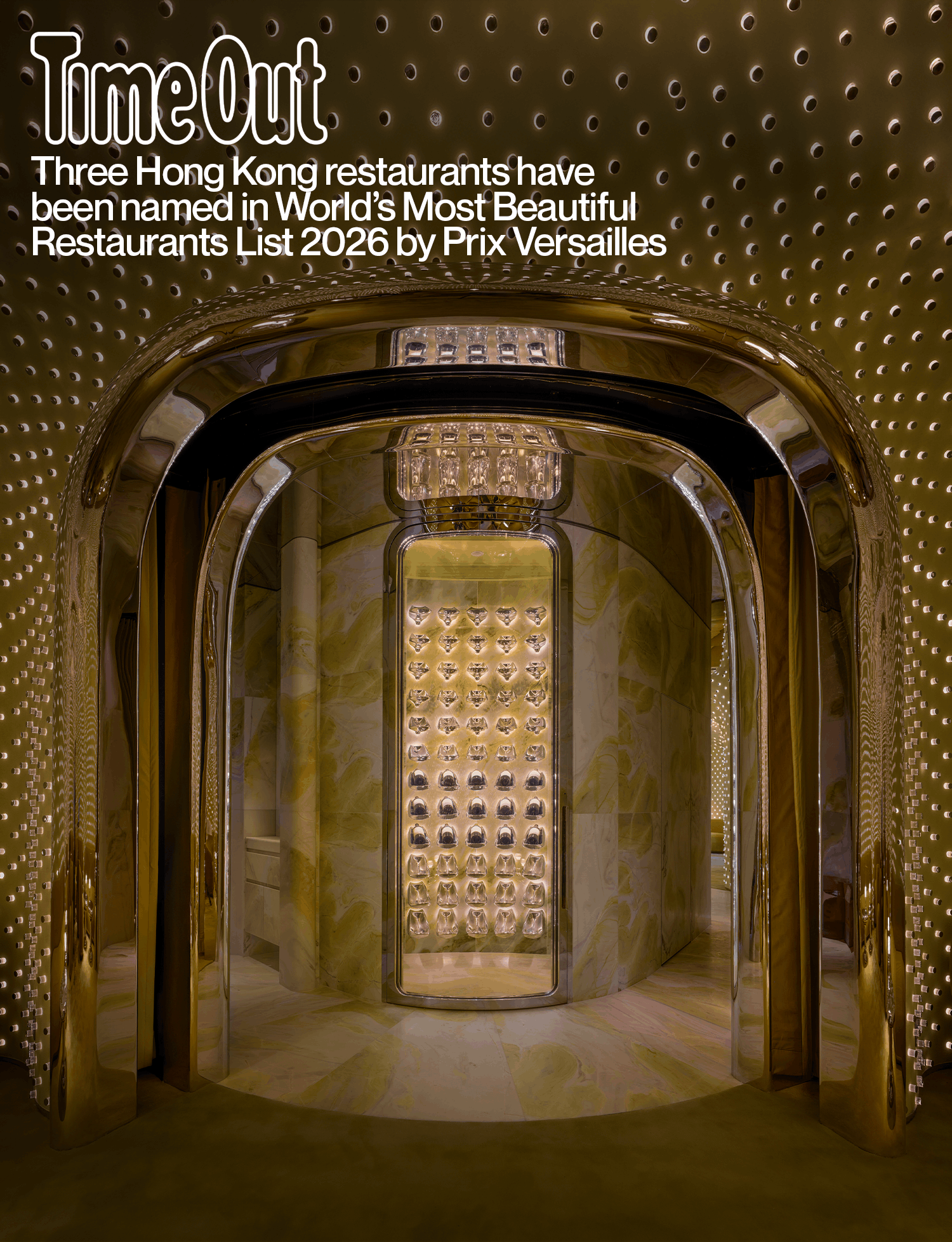 Arched passage leading to Peridot’s illuminated wine display.