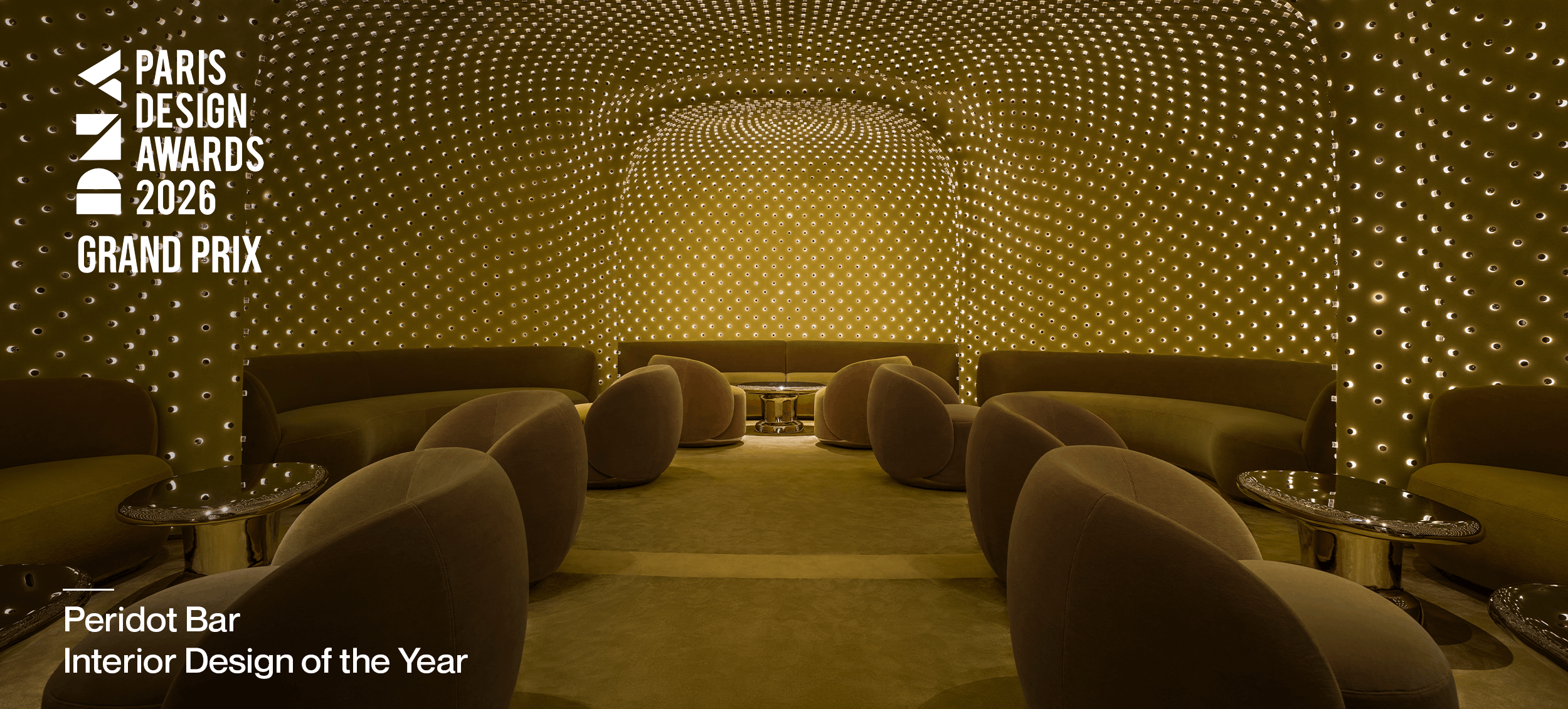 DNA Paris Design Awards Grand Prix: Peridot Bar lounge beneath a glowing perforated ceiling, with DNA Paris Design Awards Grand Prix and Interior Design of the Year text.