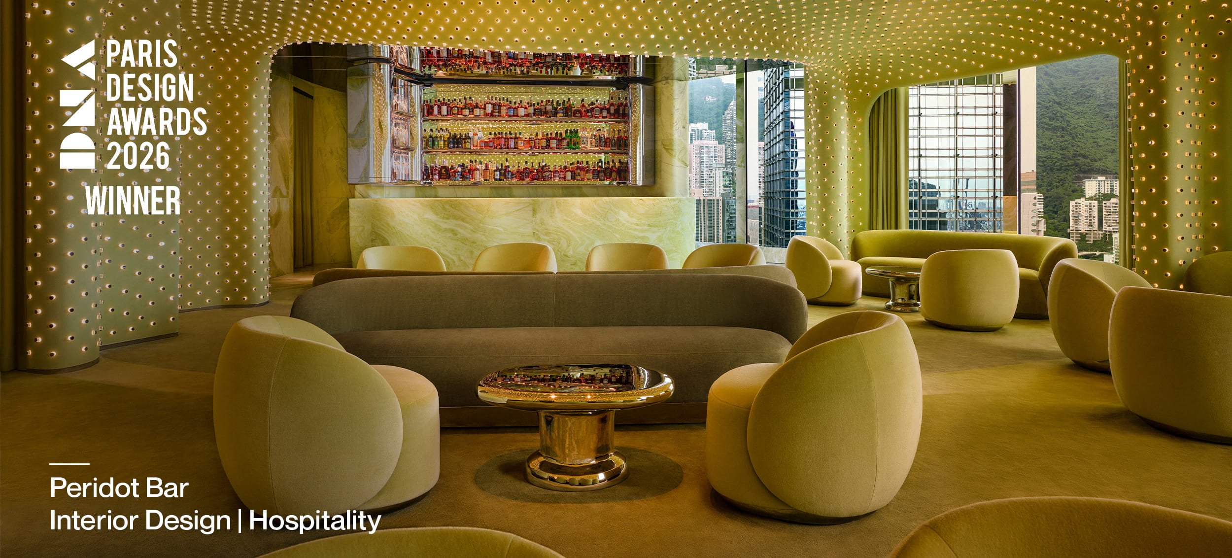 1. DNA Paris Design Awards Winner: Peridot Bar interior with curved seating and illuminated bar, with DNA Paris Design Awards winner and Interior Design | Hospitality text.