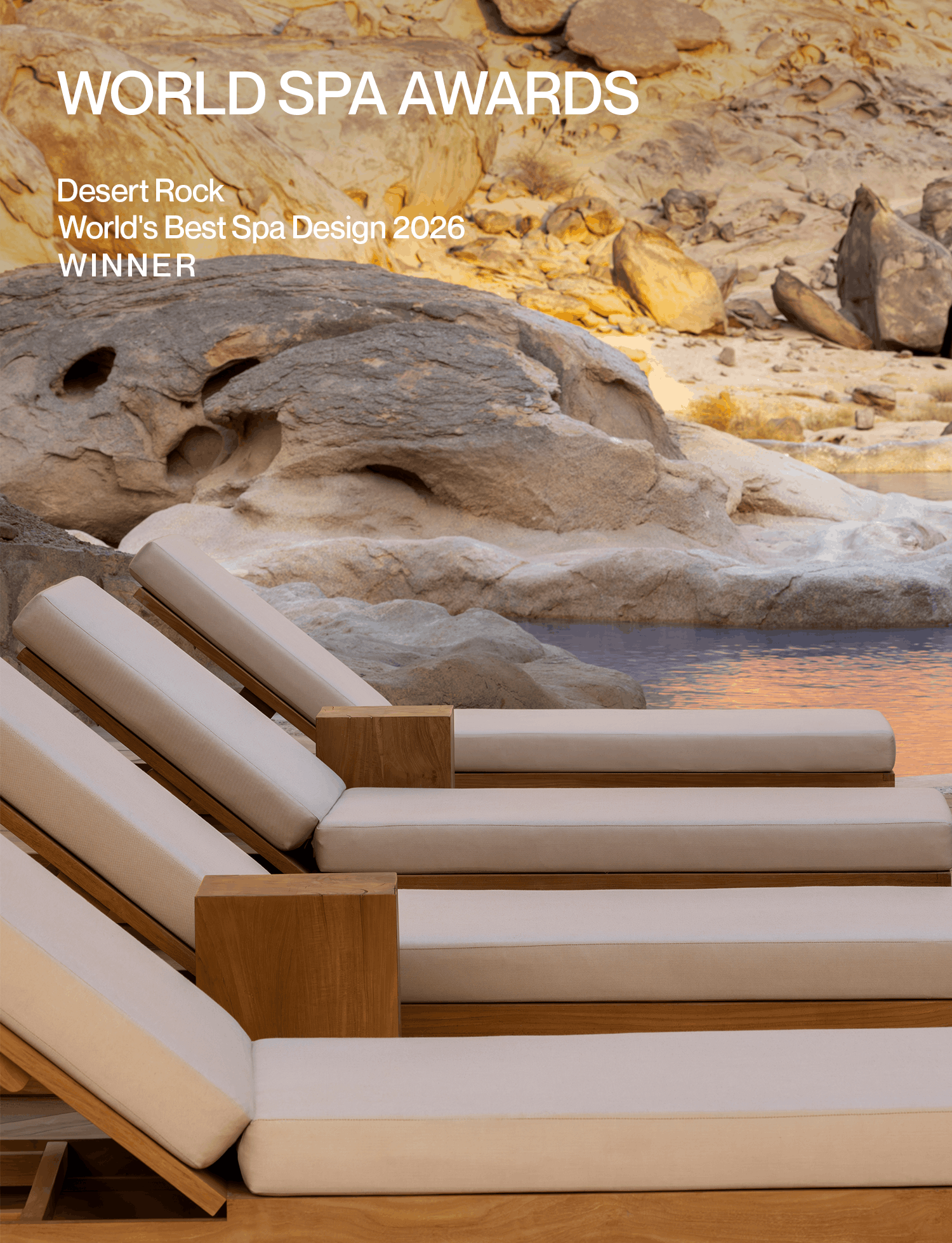 World Spa Awards: Desert Rock spa with cushioned loungers beside a reflective pool and natural rock formations.