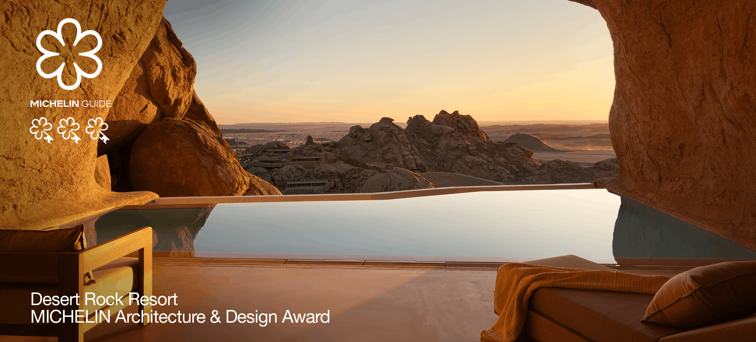 MICHELIN: Desert Rock Resort infinity pool framed by rock formations at sunset, with MICHELIN Guide branding and Architecture & Design Award text.